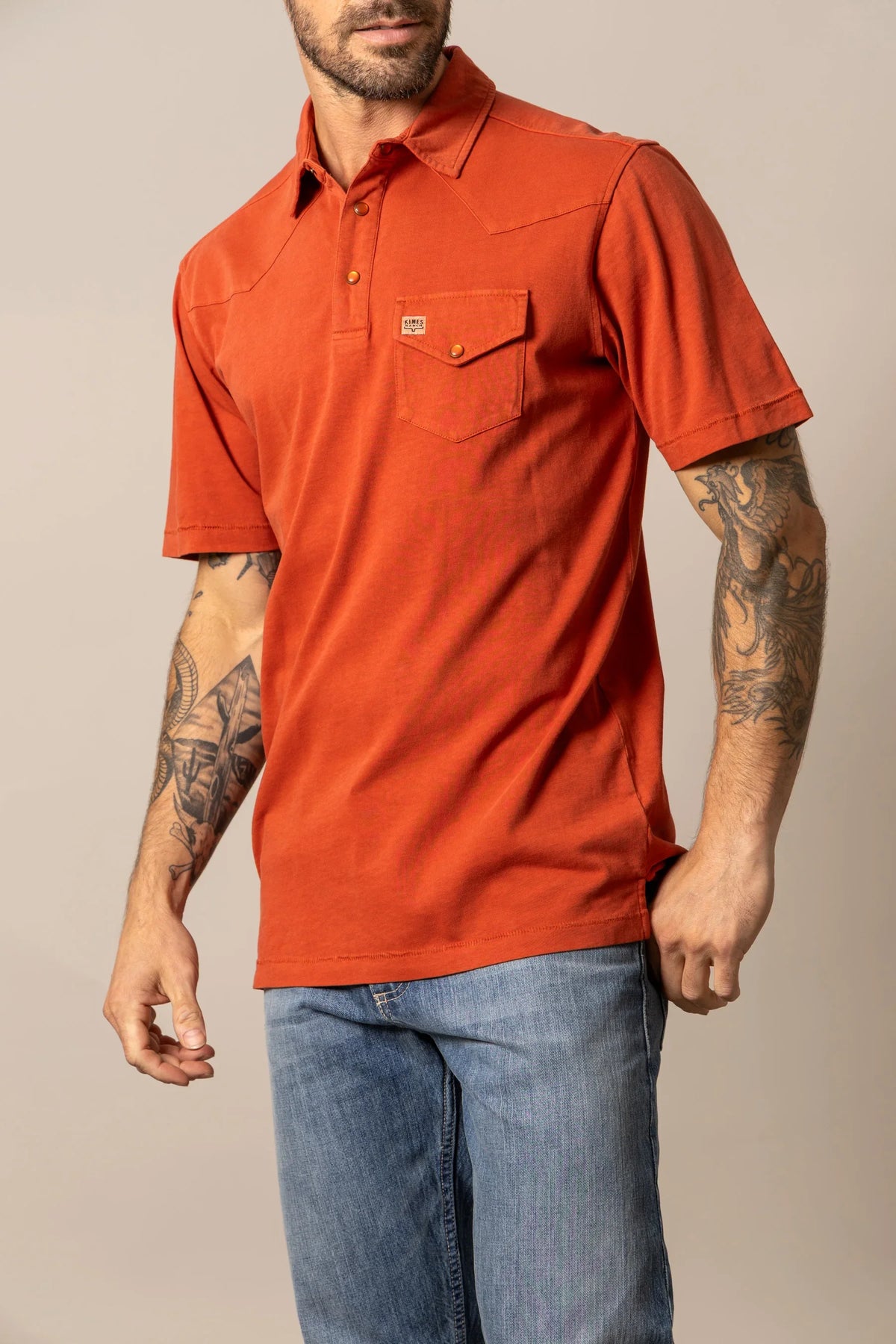 Kimes Ranch Fluger Polo in Brick Red with a chest pocket and logo patch