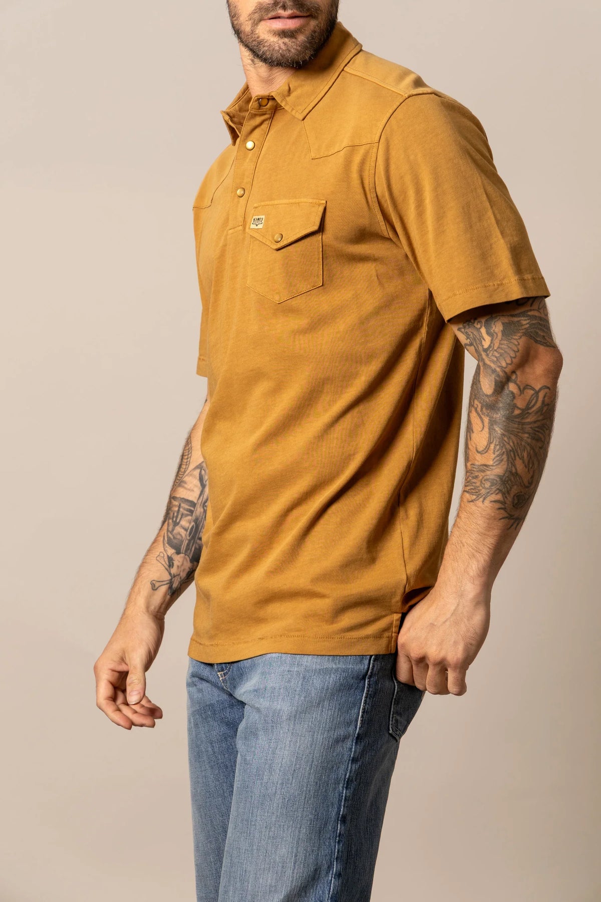 Kimes Ranch Fluger Polo in Work Wear Brown, side view, with a chest pocket and button placket