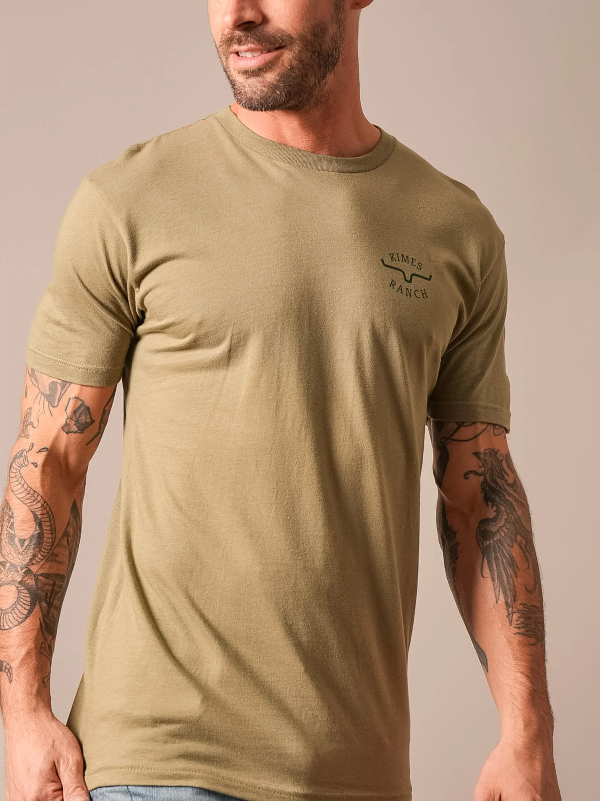 Kimes Ranch Flying High shirt in Light Olive with a crew neck and short sleeves and the Kimes Ranch logo on the chest