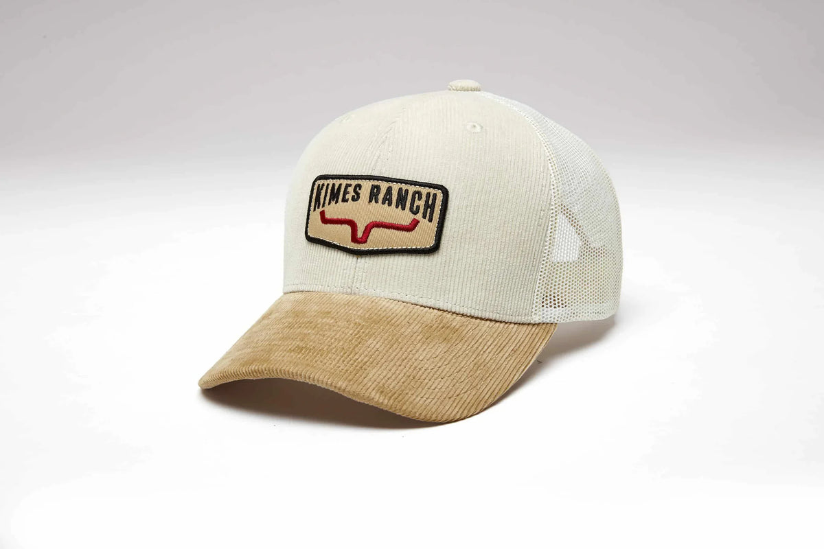 Kimes Ranch Fourteen hat in Natural, side view, with a brim and the Kimes Ranch logo patch