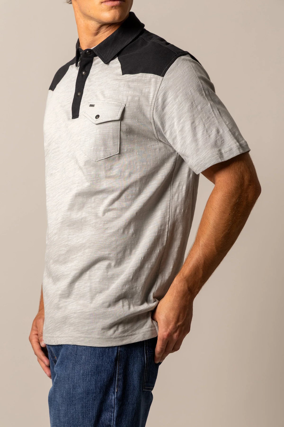 Kimes Ranch G-2 Polo in Grey, side view, with black yoke and collar, featuring a chest pocket with button closure
