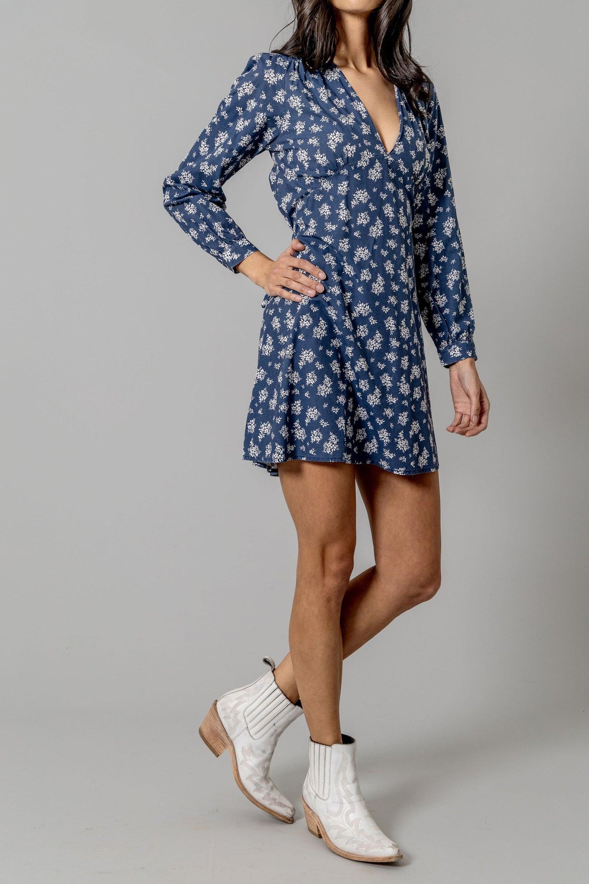 Kimes Ranch Georgina Tencel Dress in Blue, side view, with a white floral print, long sleeves, and a V-neckline