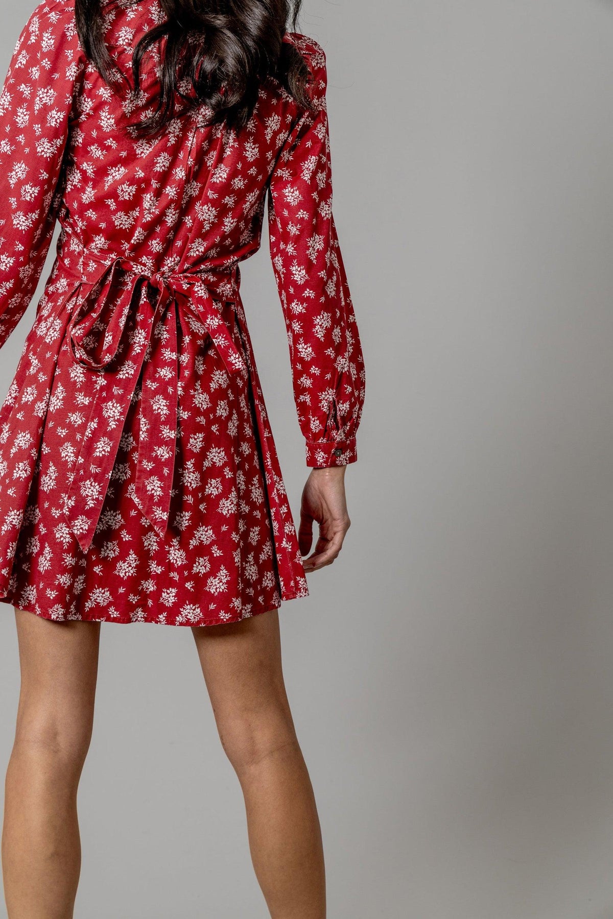 Kimes Ranch Georgina Tencel Dress in Red, back view, with a white floral print and a tied waist belt