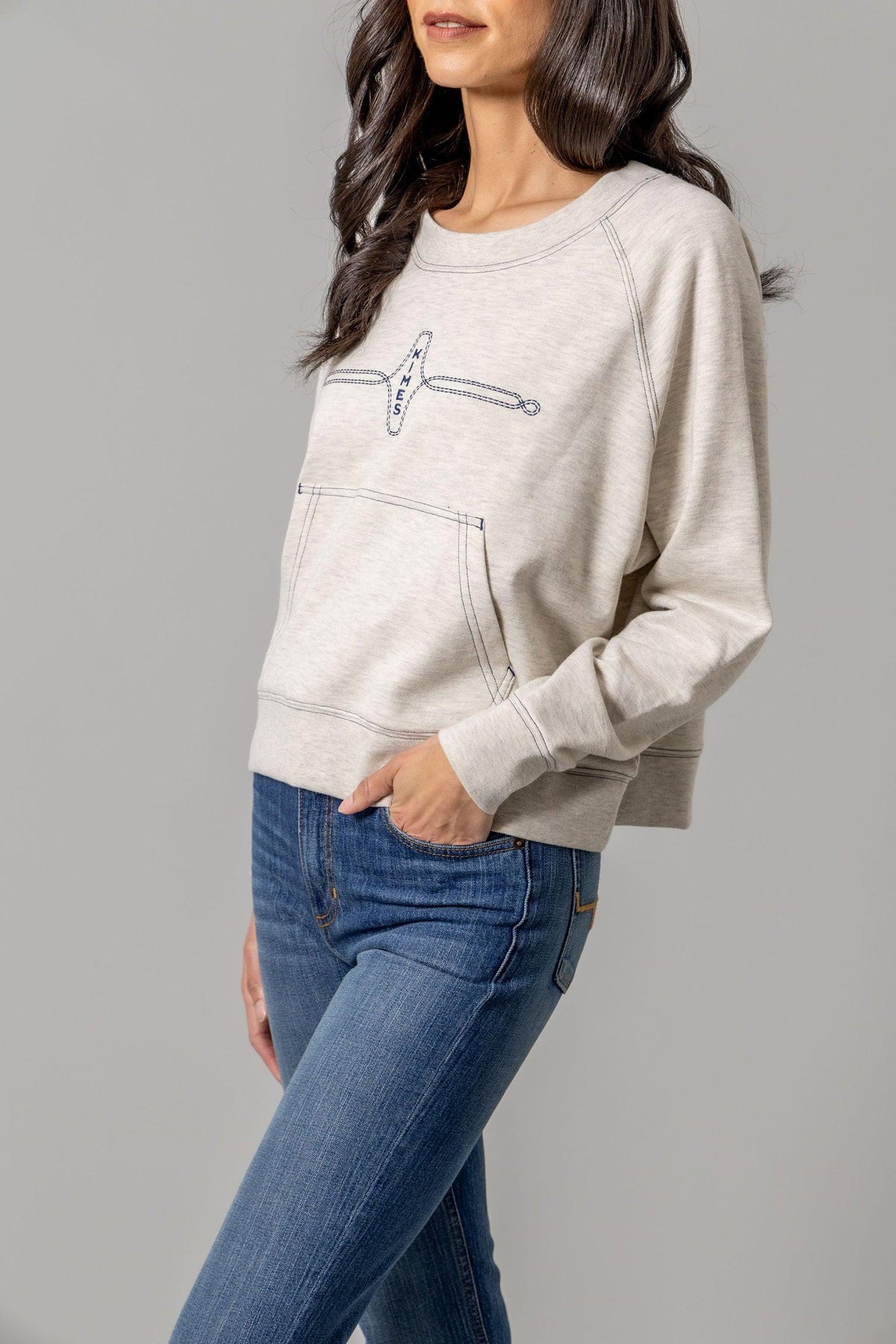 Kimes Ranch Gracie Cropped Crewneck sweatshirt in Light Grey, side view, with a front kangaroo pocket and logo embroidery
