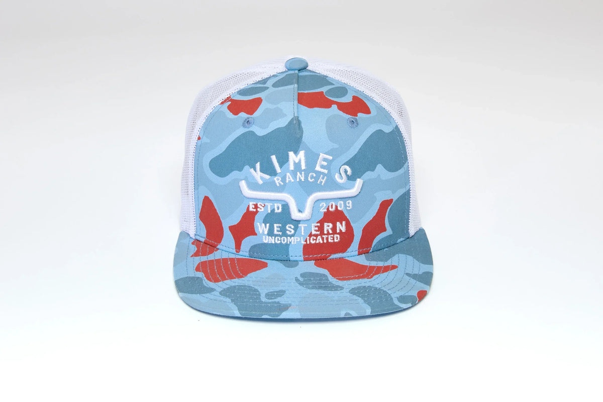 Kimes Ranch Grandview Trucker hat in Blue with a camo pattern and the Kimes Ranch logo with Western Uncomplicated text