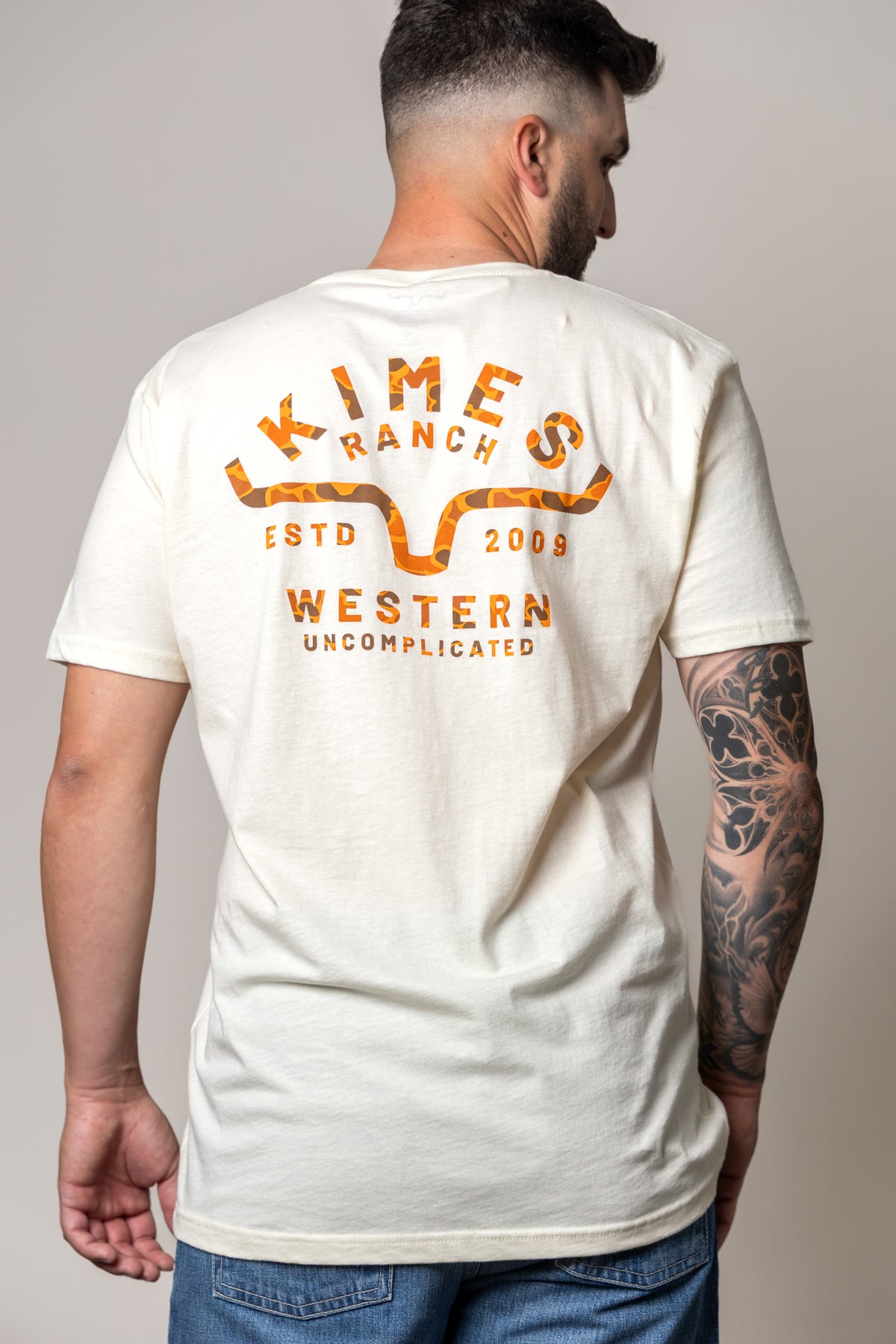 Kimes Ranch Grandview shirt in Natural, back view, with a back graphic featuring the Kimes Ranch logo