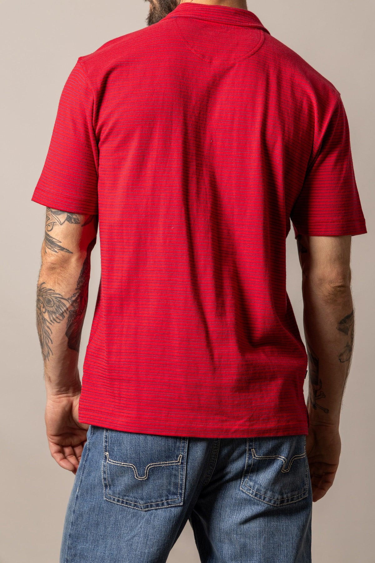 Kimes Ranch Harlan Polo in Red, back view, with a striped texture and short sleeves