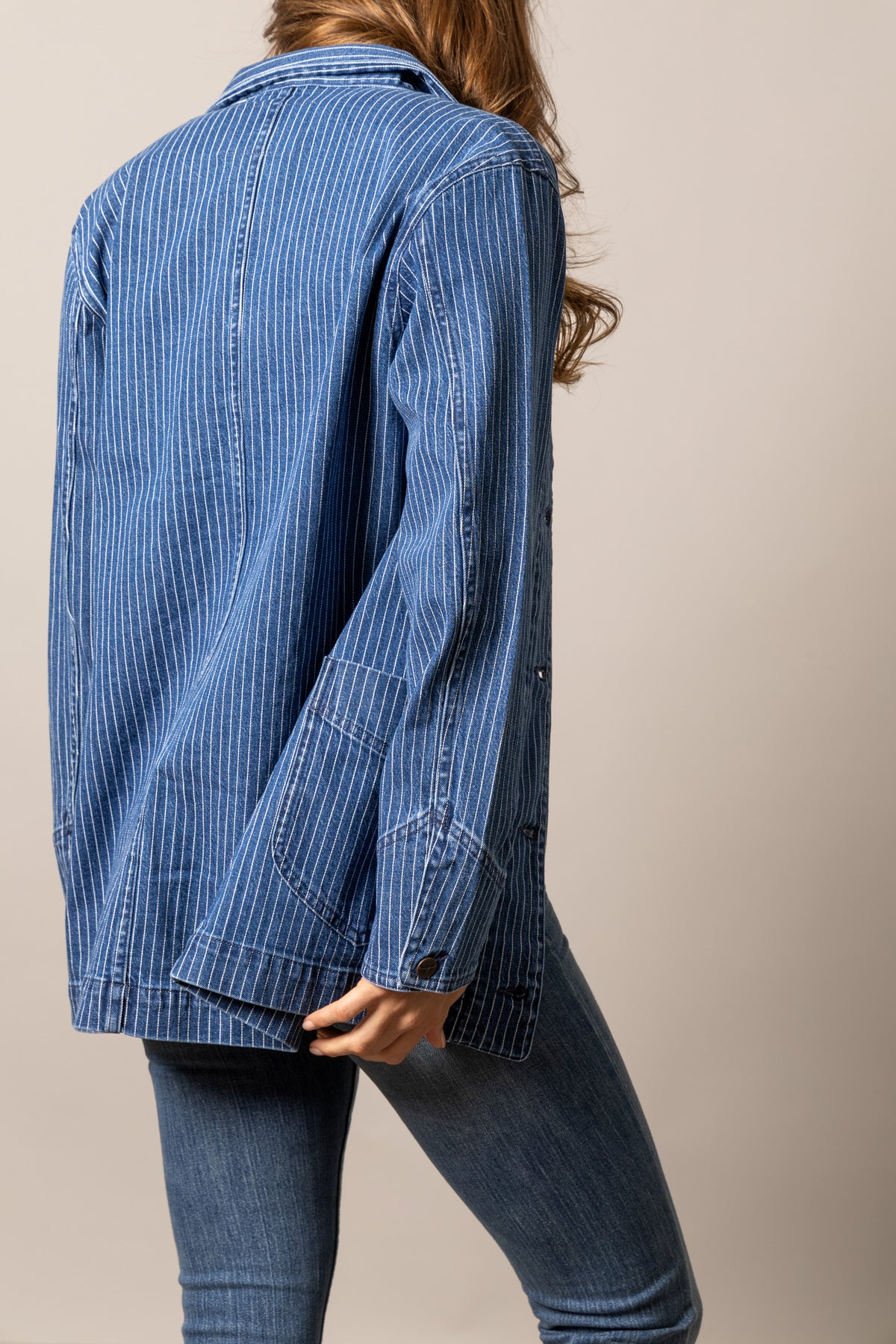 Kimes Ranch Harlow jacket in Indigo Stripe, side view, with long sleeves and button cuffs