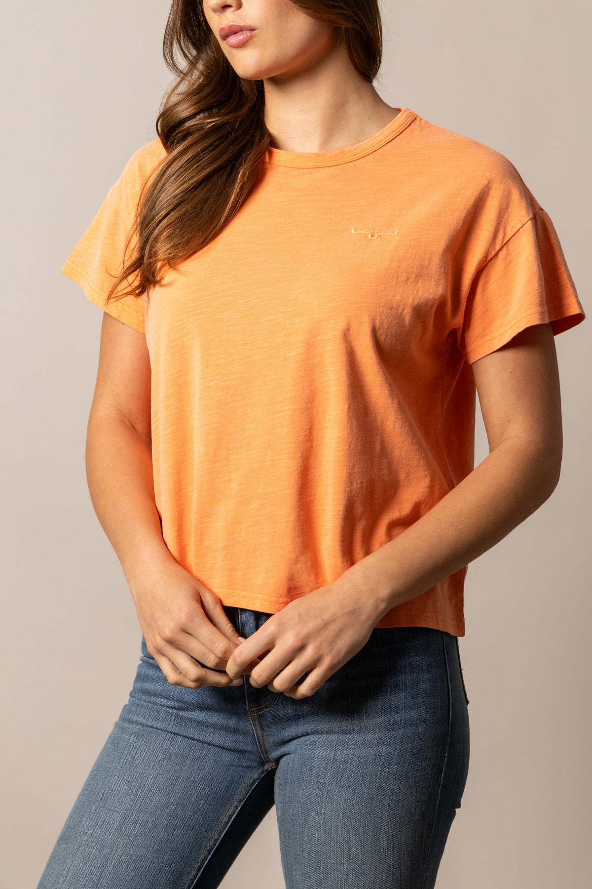 Kimes Ranch Hayloft shirt in Orange with short sleeves and a small embroidered logo on the chest