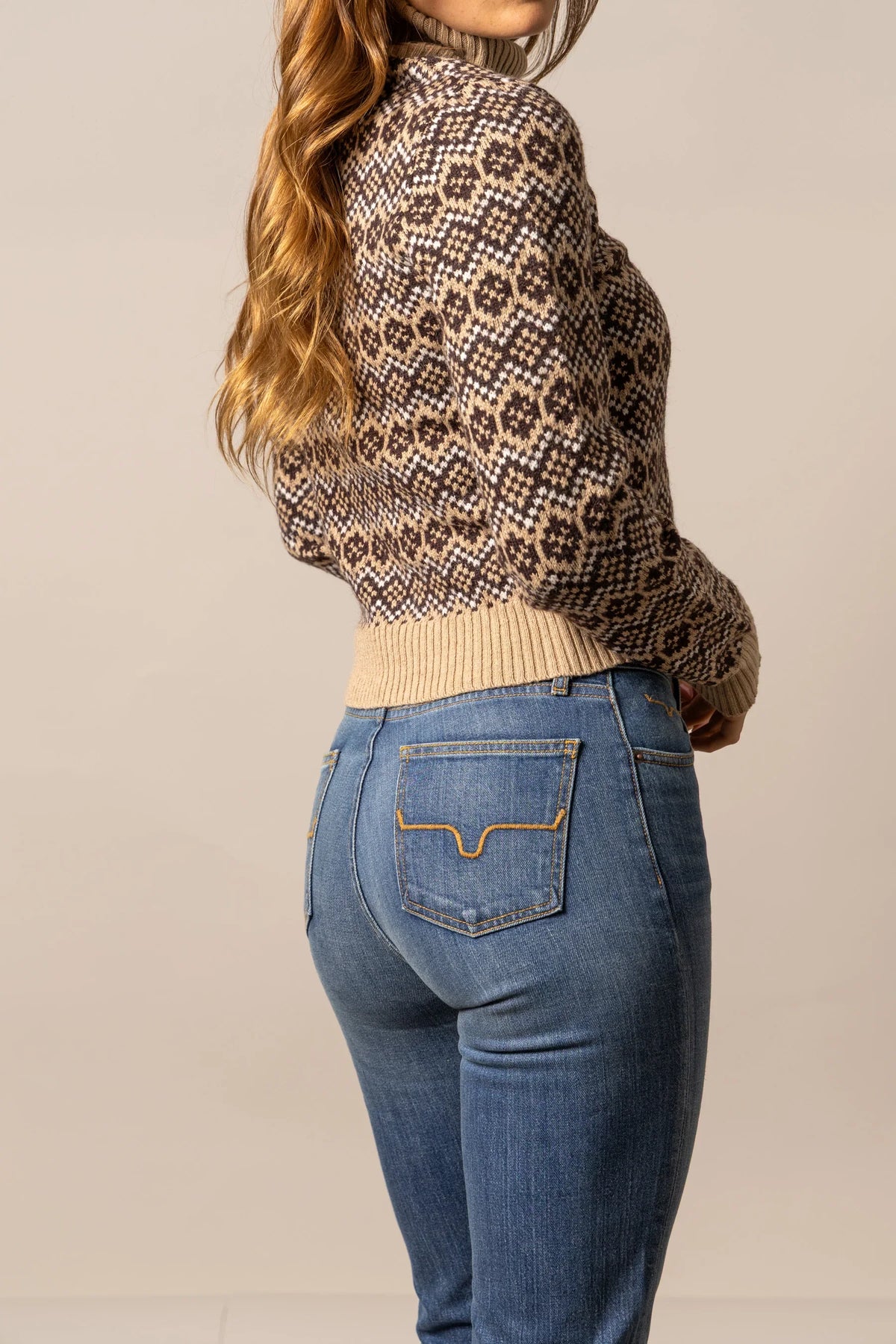 Kimes Ranch Hazel Turtleneck in Coffee, side view, with a brown and tan geometric pattern and ribbed hem