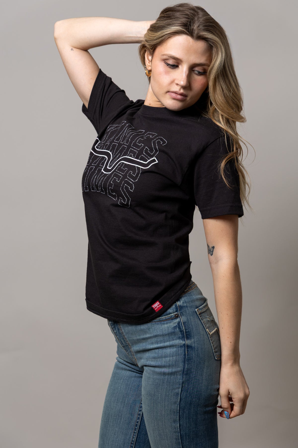 Kimes Ranch Heavy Branded shirt in Black, side view, with a large white outlined graphic print on the front