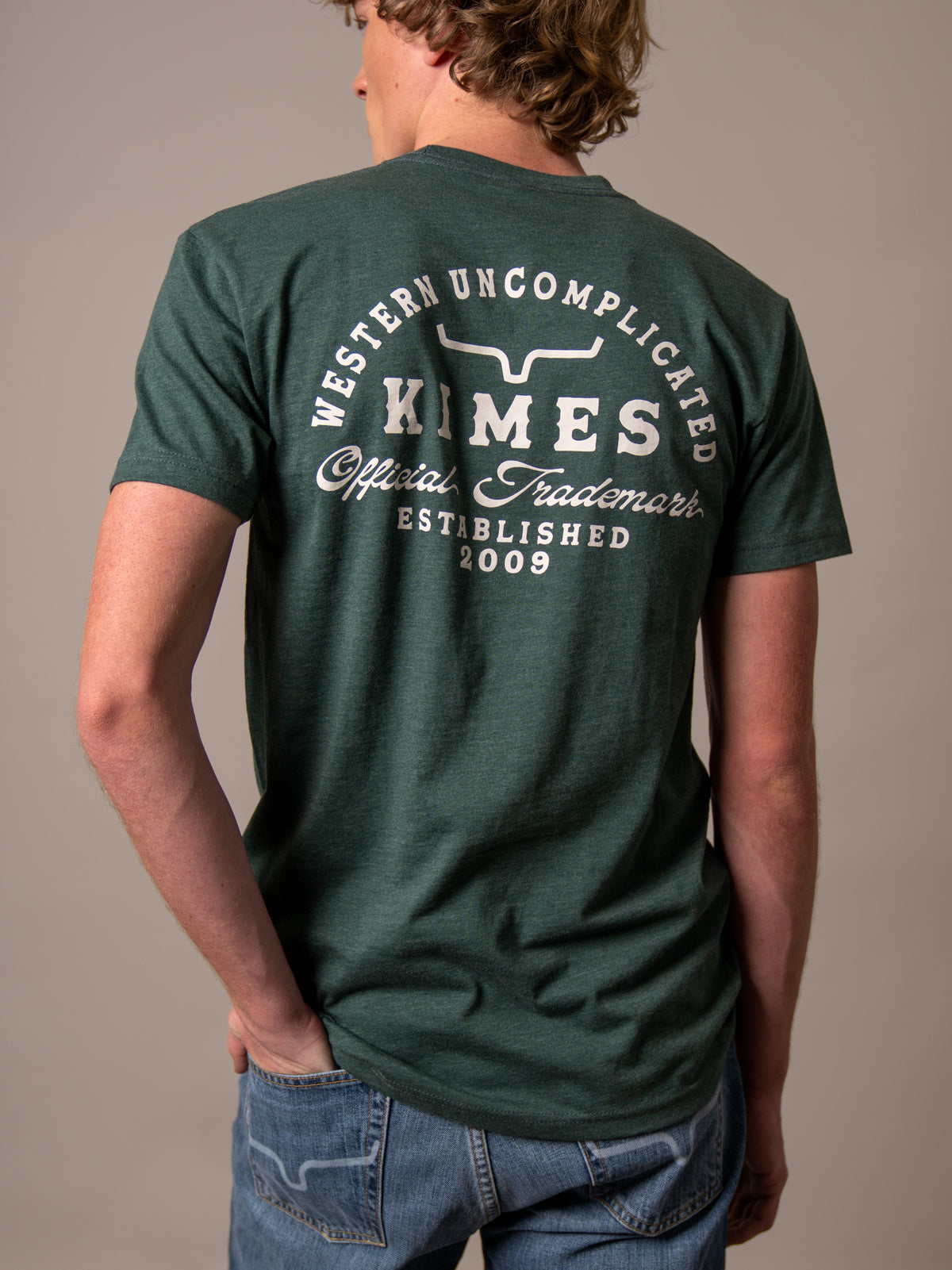 Kimes Ranch Heavy Text shirt in Heather Forest Green, back view