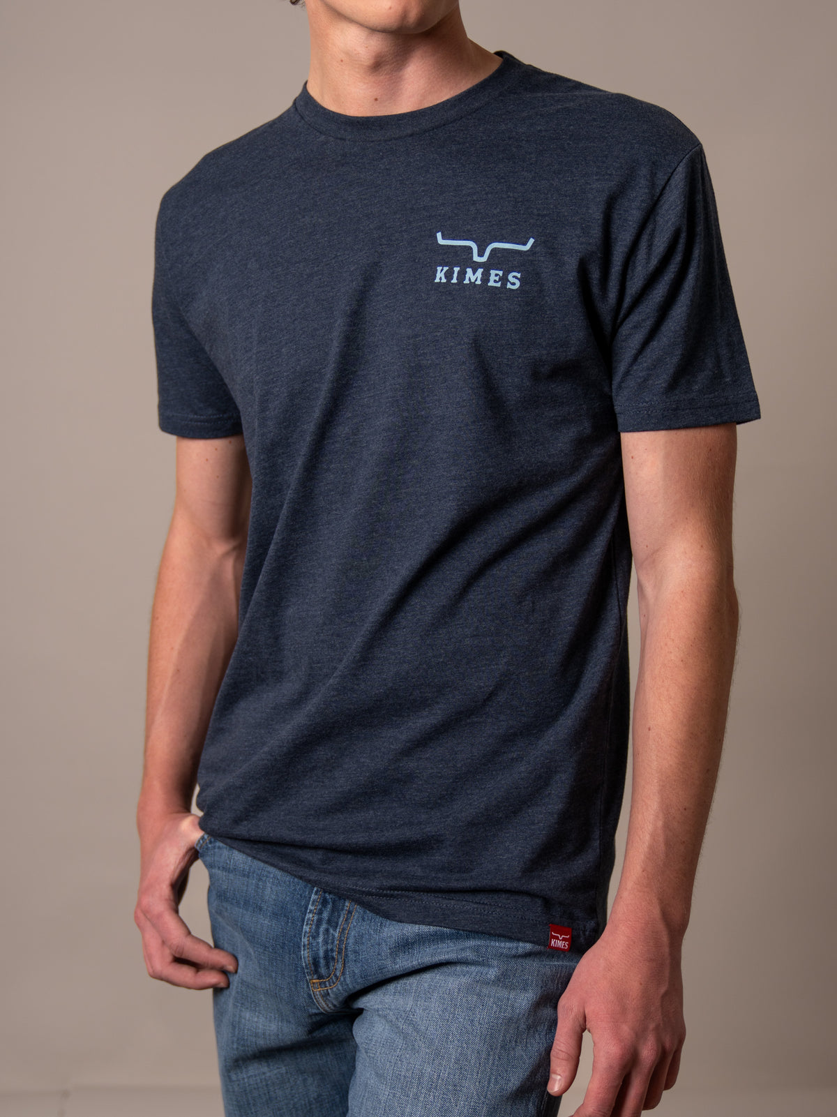 Kimes Ranch Heavy Text shirt in Midnight Navy with a chest logo and a red hem tag
