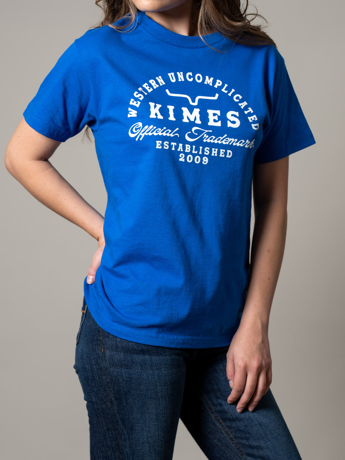 Kimes Ranch Branded shirt in Royal Blue with a white Western Uncomplicated Official Trademark Established 2009 graphic