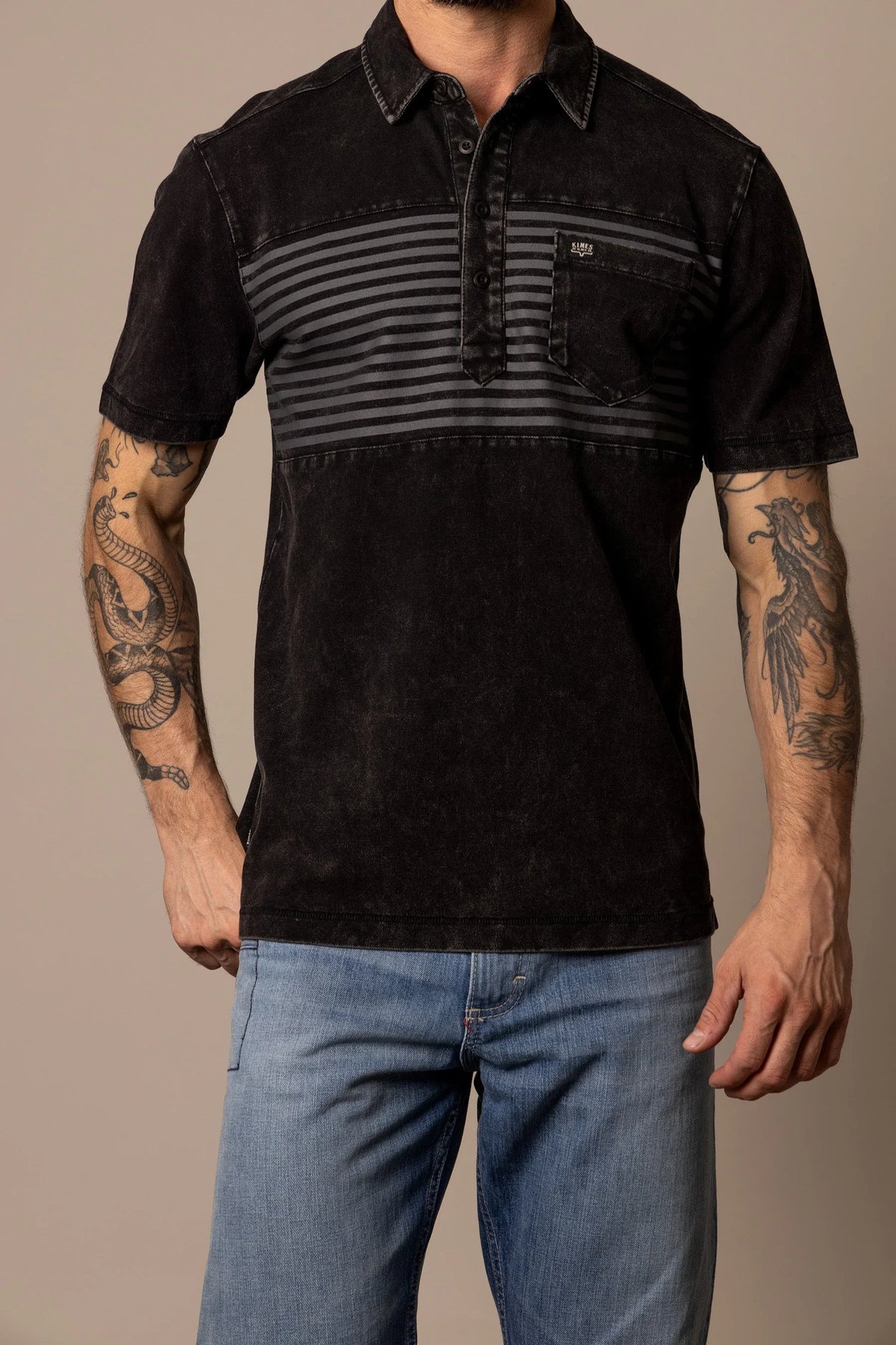 Kimes Ranch Holbrook Polo in Black with horizontal stripes across the chest and a chest pocket