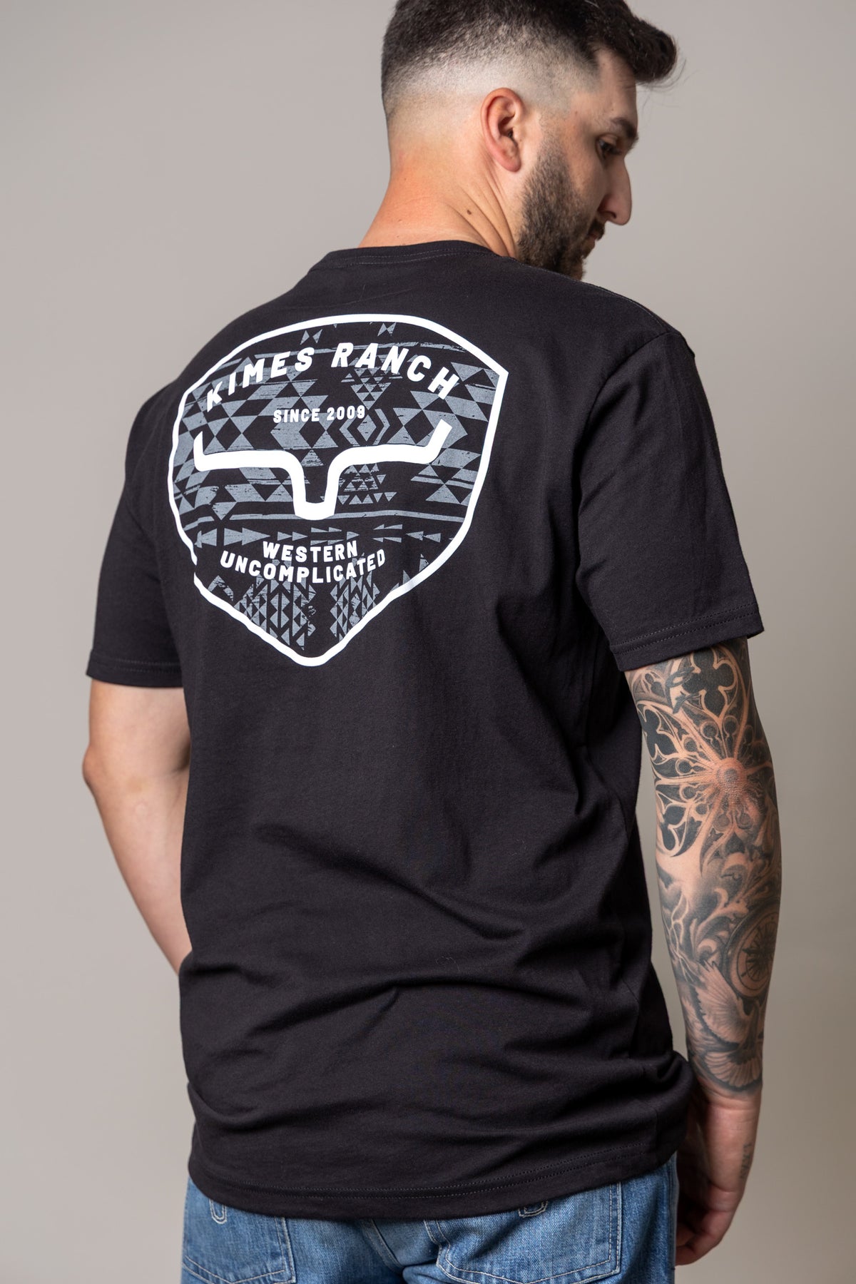 Kimes Ranch Honor shirt in Black, back view, with a large back graphic featuring the Kimes Ranch logo