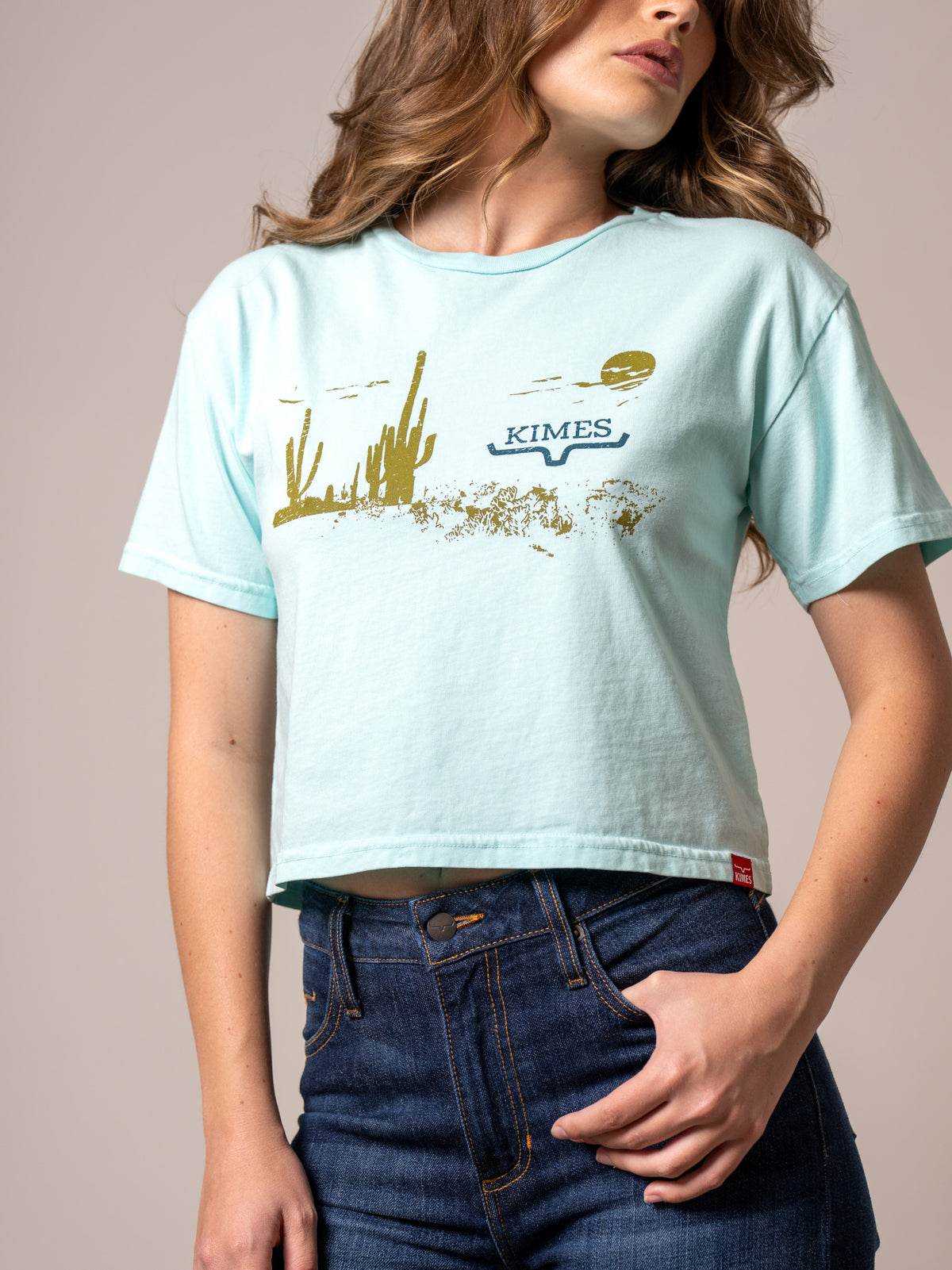 Kimes Ranch Horizon West Mint short sleeve shirt with a gold cactus and Kimes Ranch logo graphic print