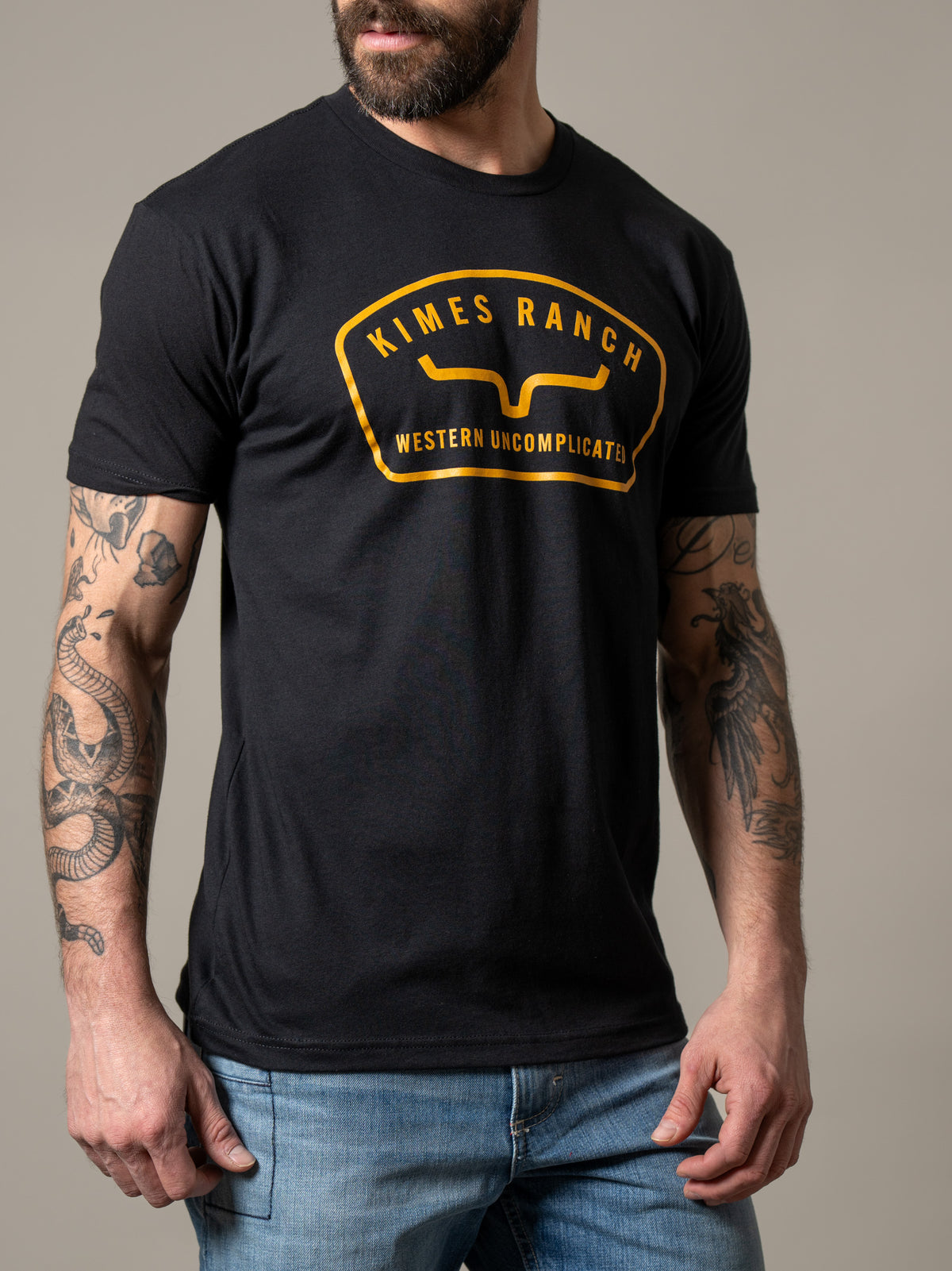 Kimes Ranch Hunton shirt in Black with a gold Kimes Ranch logo and Western Uncomplicated text