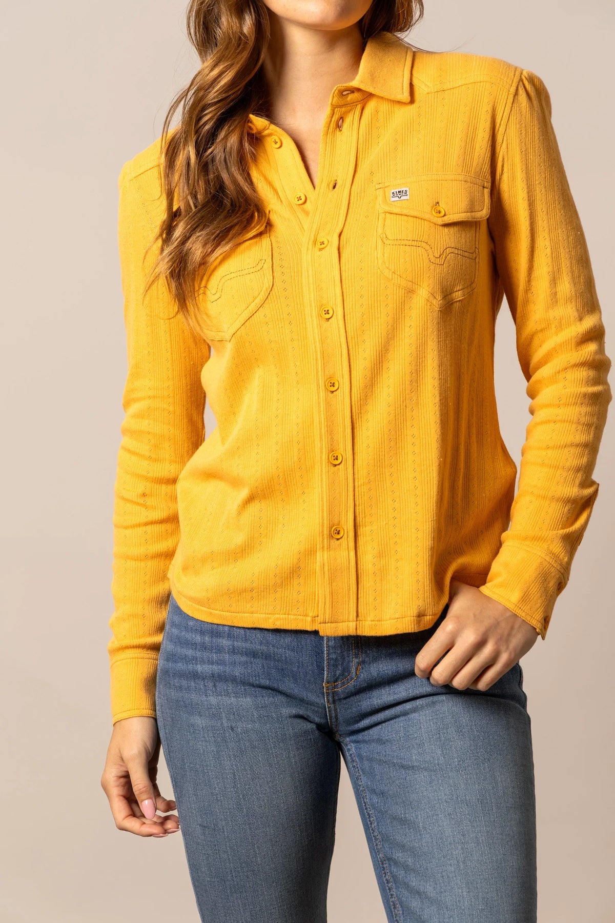 Kimes Ranch Isabel Pointelle top in Yellow Ochre with long sleeves and front pockets