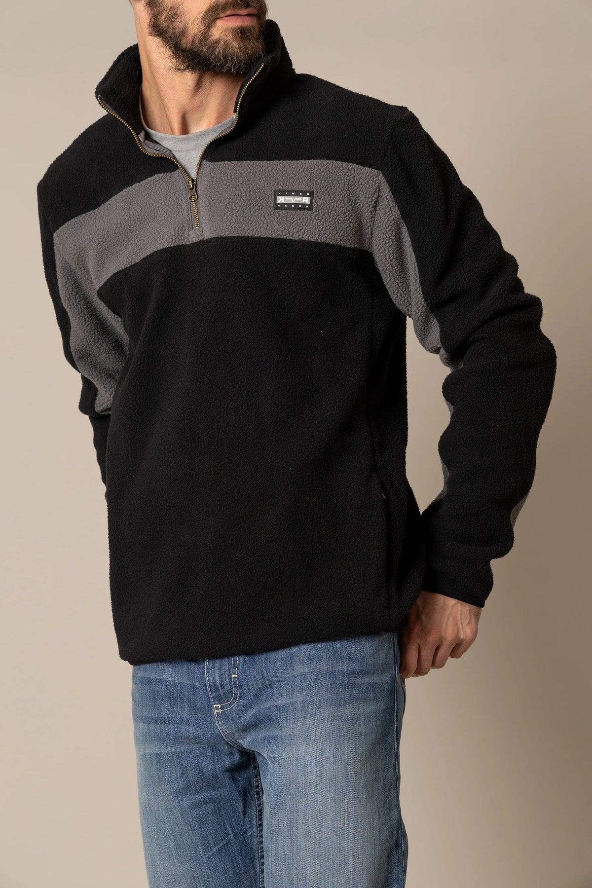 Kimes Ranch JMJ Quarter Zip sweatshirt in Black with a grey chest stripe and logo patch