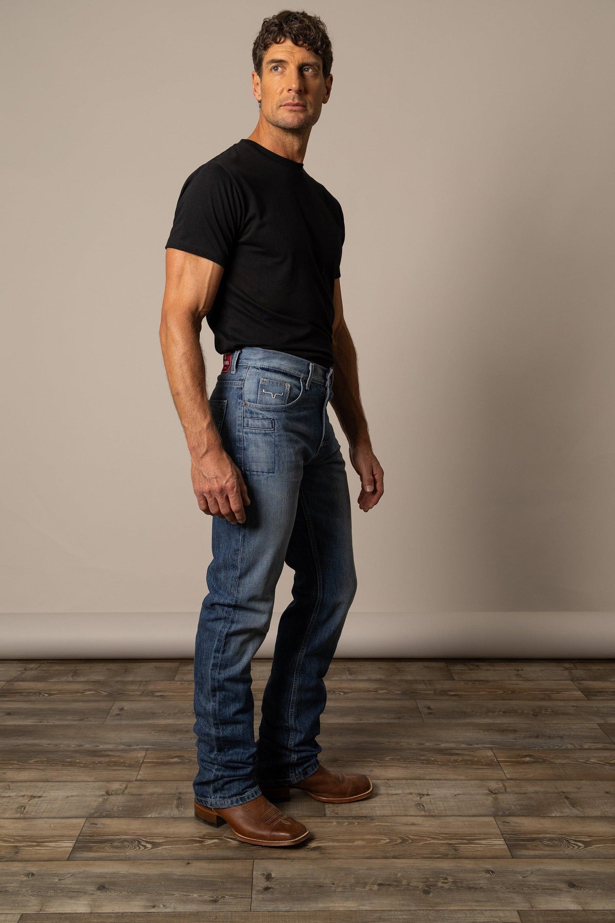 Kimes Ranch James Straight Fit Bootcut jeans in Mid Wash, side view, with a classic five-pocket design and visible stitching