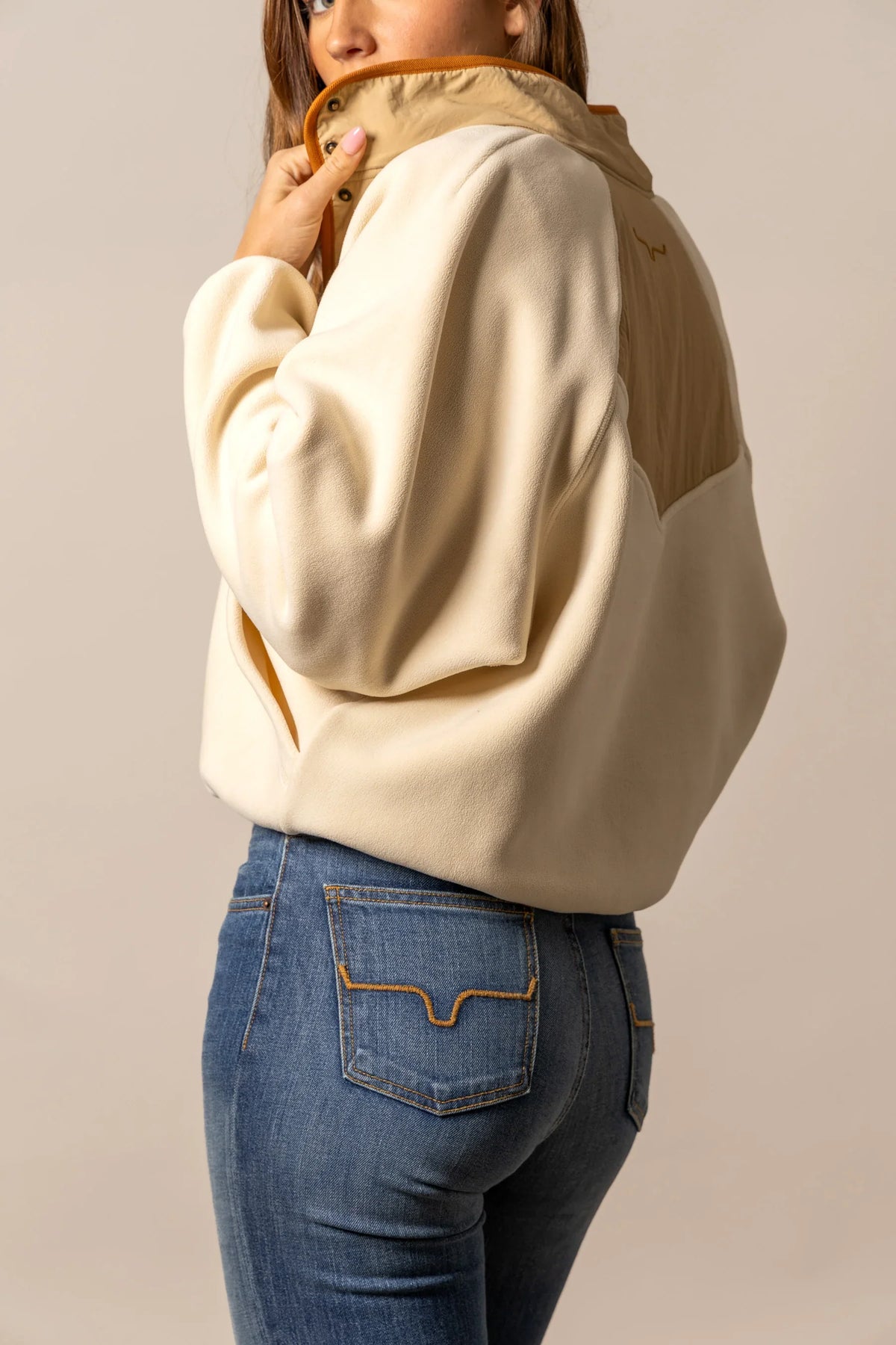Kimes Ranch Josie Fleece sweatshirt in Natural, side view, with contrast tan shoulder panel and embroidered logo