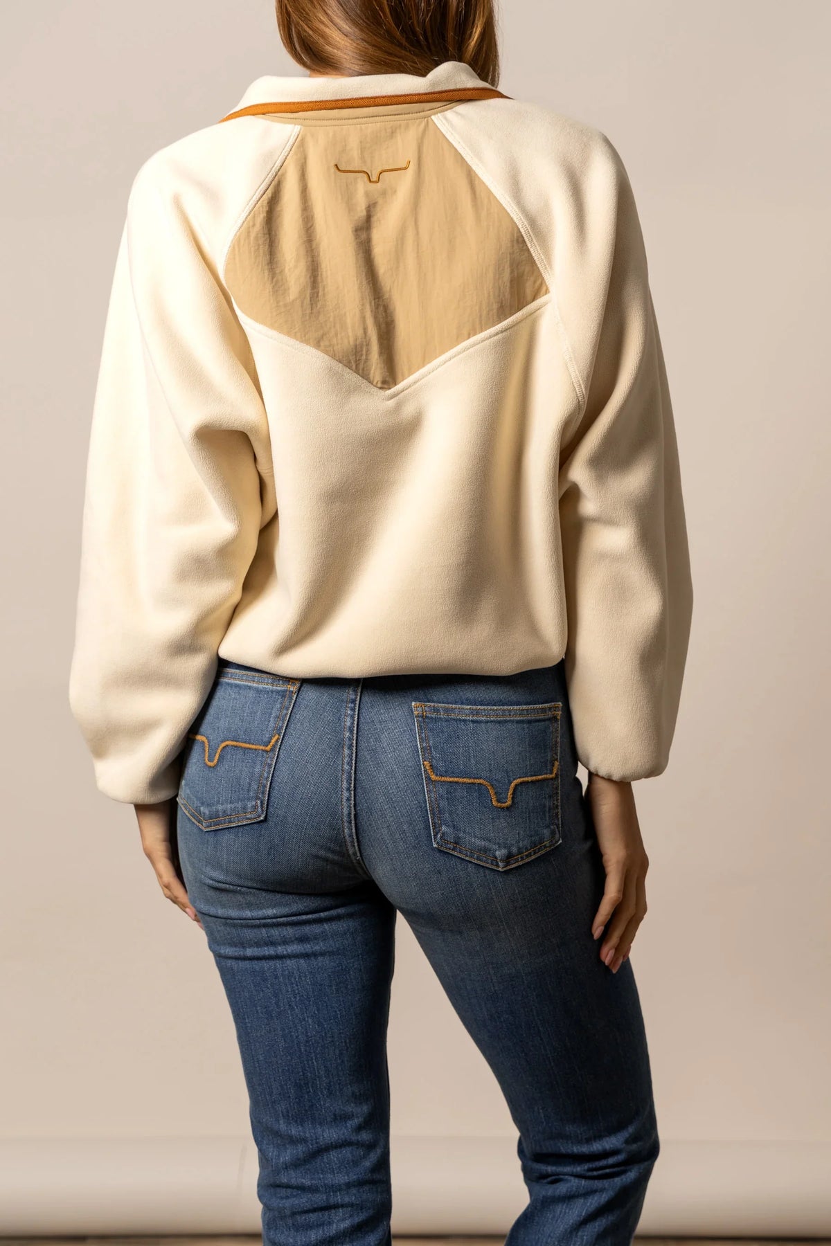 Kimes Ranch Josie Fleece sweatshirt in Natural, back view, with a tan back yoke and embroidered logo