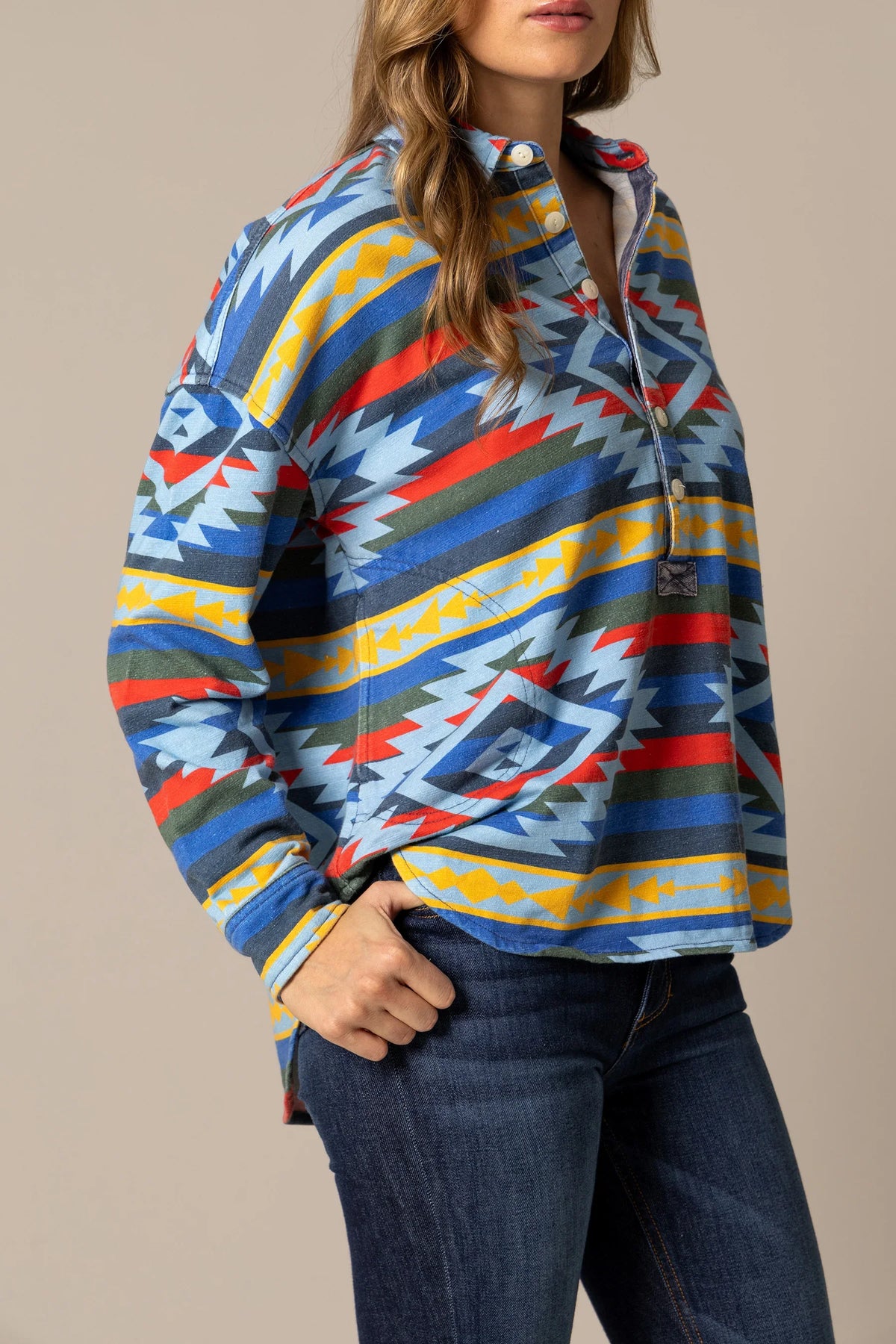 Kimes Ranch Judith sweater in Dark Blue, side view, with a multi-color geometric pattern and a front pocket