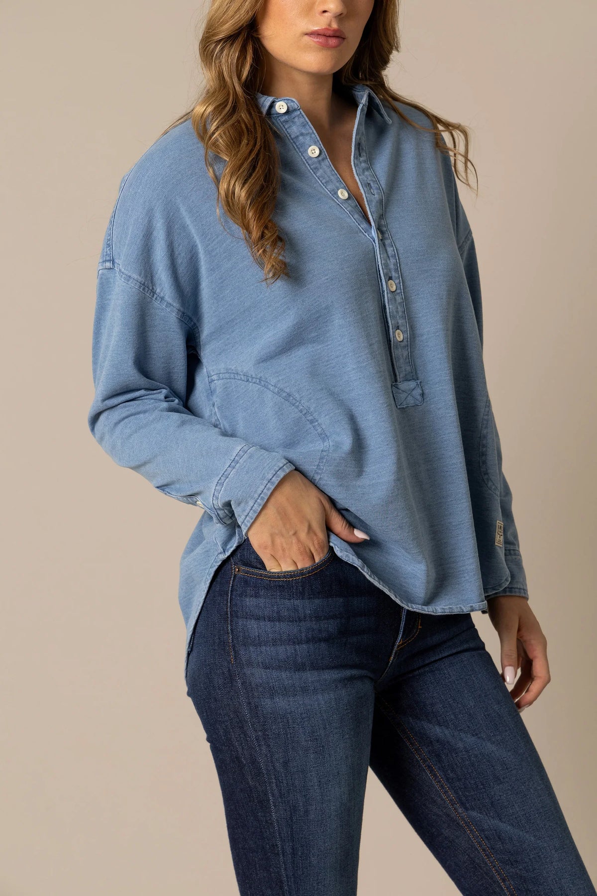 Kimes Ranch Judith sweater in Lt Wash Indigo, side view, with a button placket and front pockets