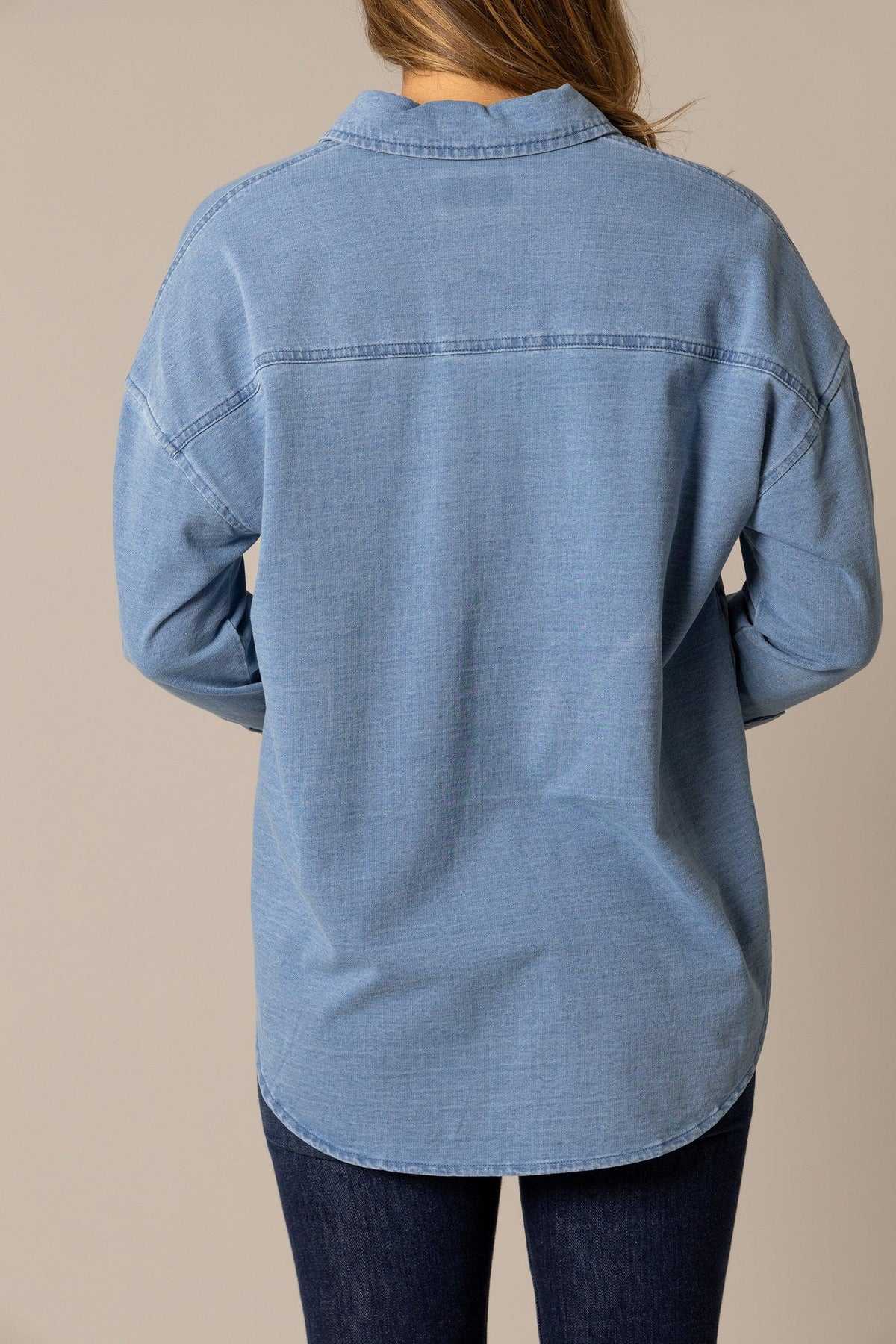 Kimes Ranch Judith sweater in Lt Wash Indigo, back view, with a back yoke seam and long sleeves