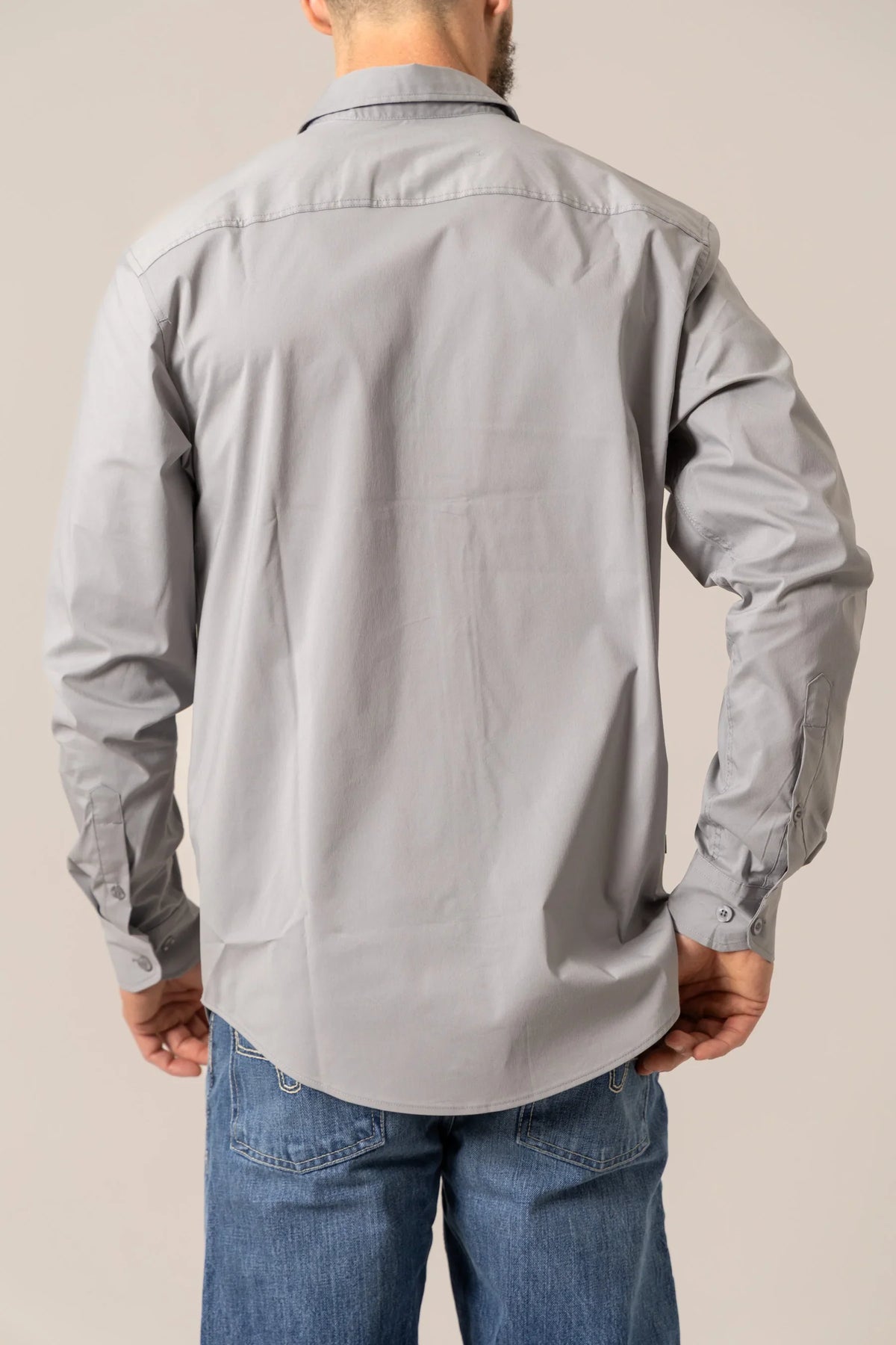 Kimes Ranch KR Team Dress Shirt in Grey, back view, with long sleeves and button cuffs