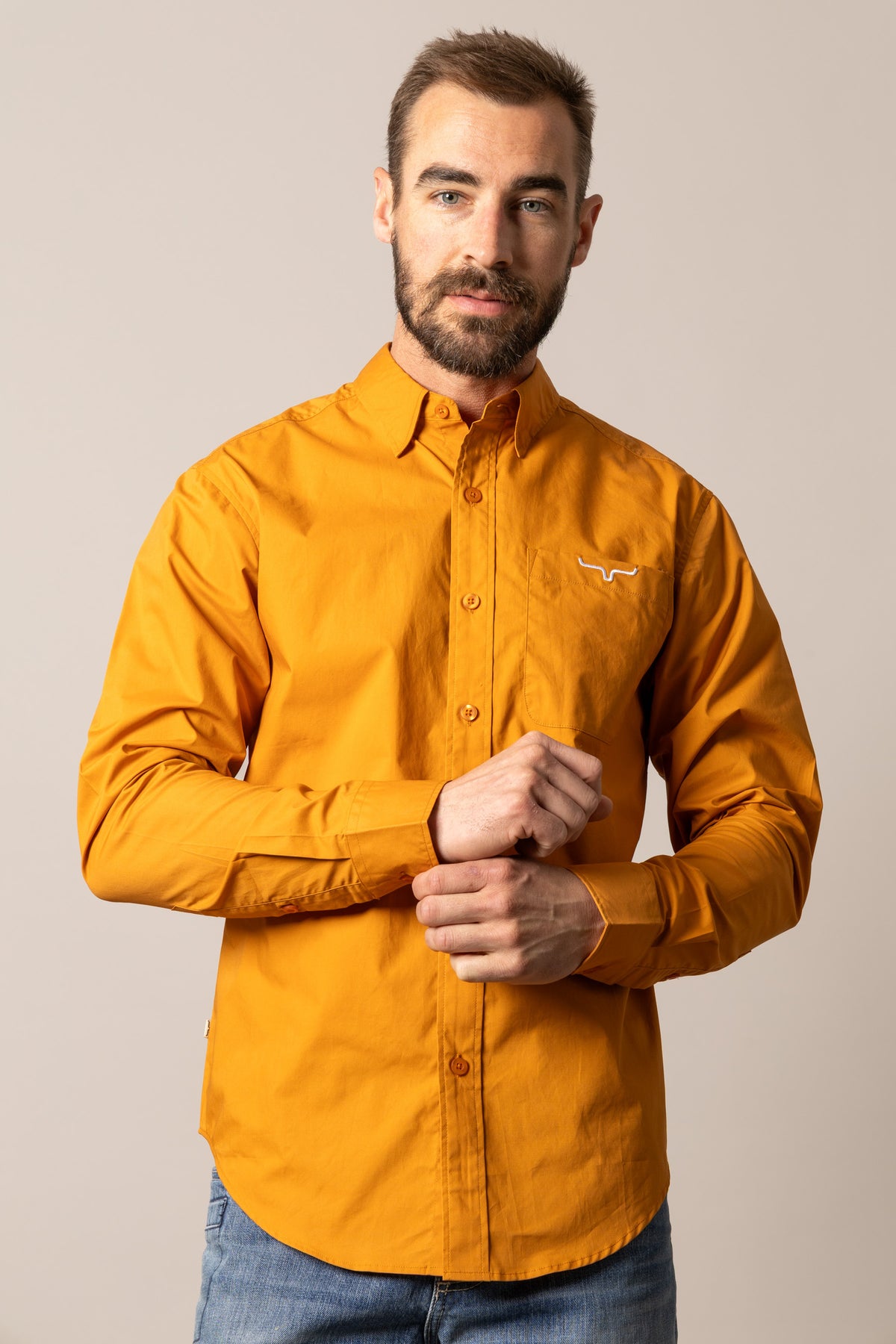 Kimes Ranch KR Team Dress Shirt in Vintage Orange with long sleeves, button front, and chest pocket with logo