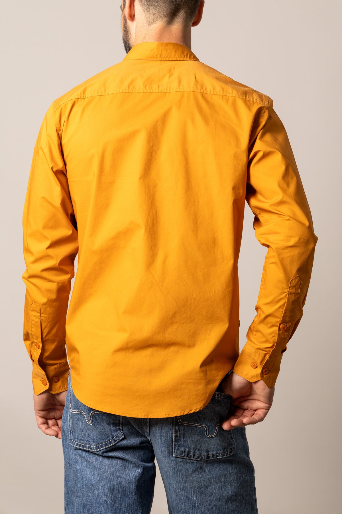 Kimes Ranch KR Team Dress Shirt in Vintage Orange, back view, with long sleeves and button cuffs