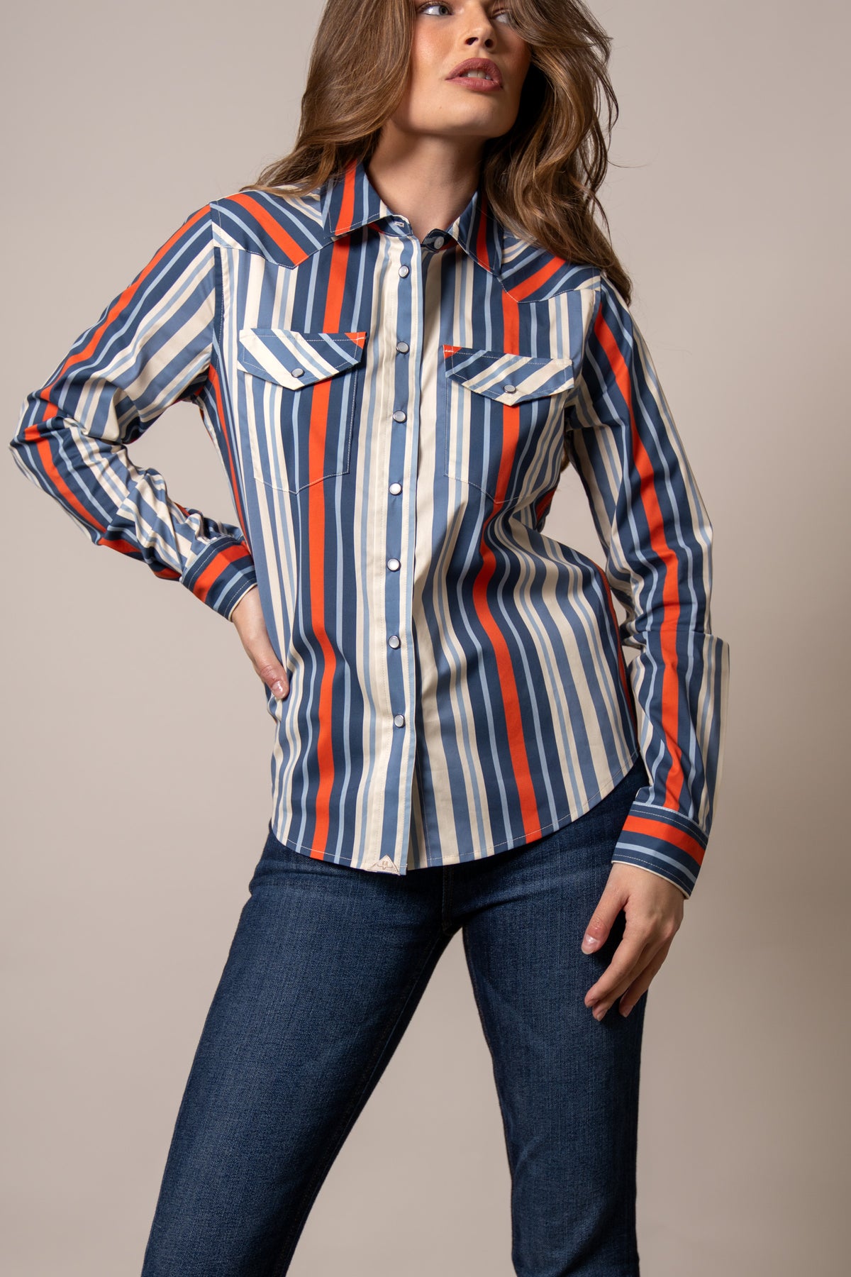 Kimes Ranch Kai top in Blue with orange and white vertical stripes, western yoke, and button flap pockets