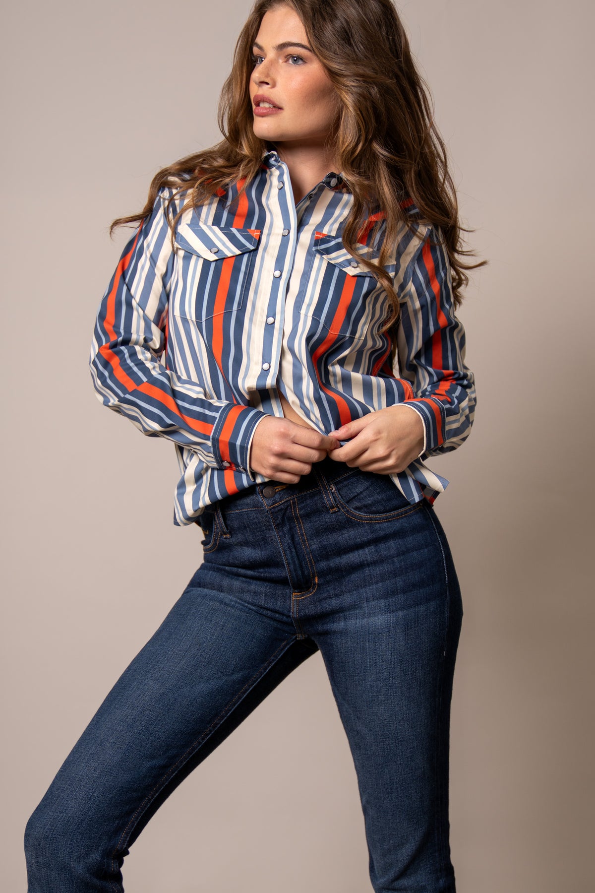 Kimes Ranch Kai top in Blue with orange and white vertical stripes, long sleeves, and two chest pockets