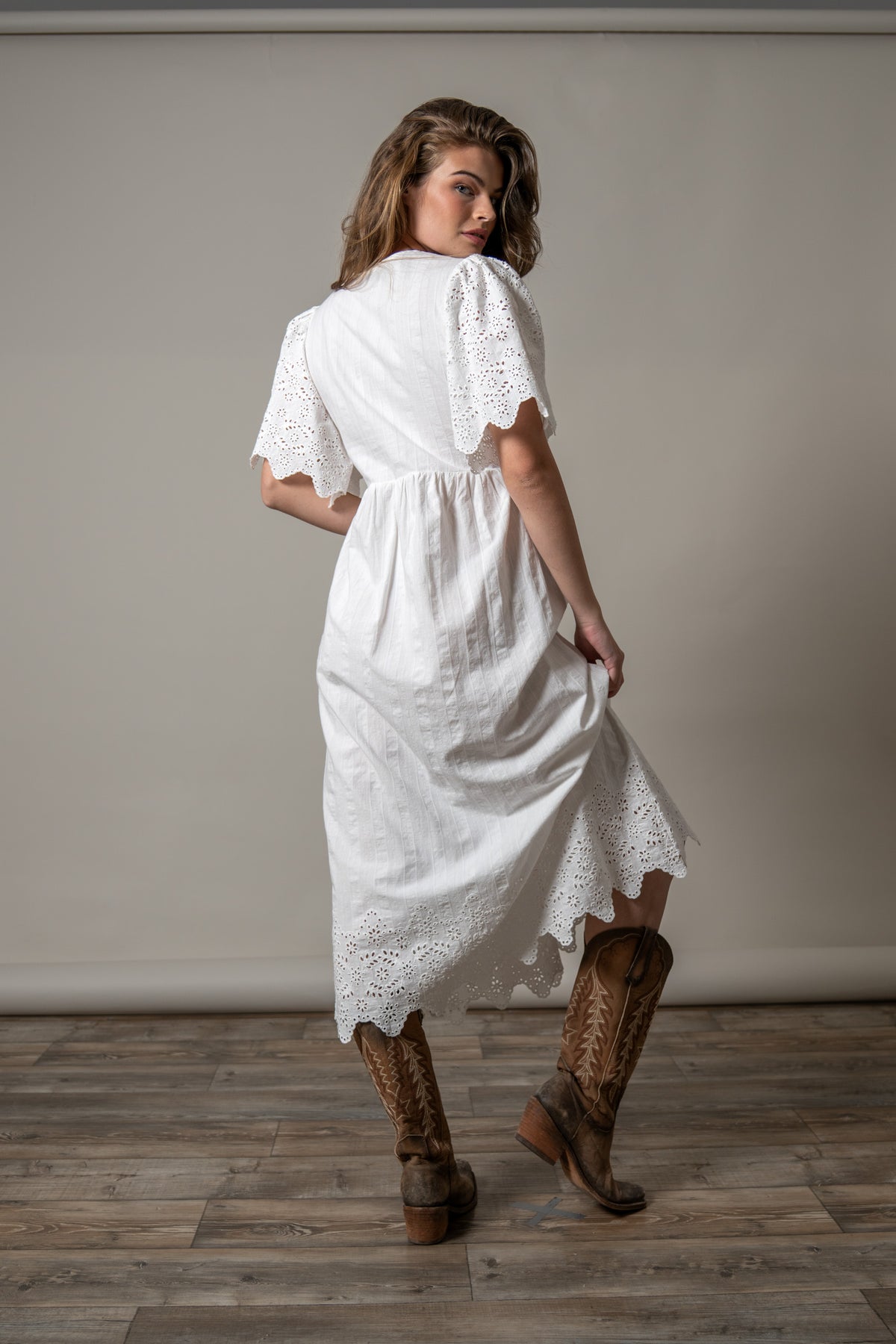 Kimes Ranch Kelsey dress in Pristine, back view, with eyelet trim on the sleeves and hem