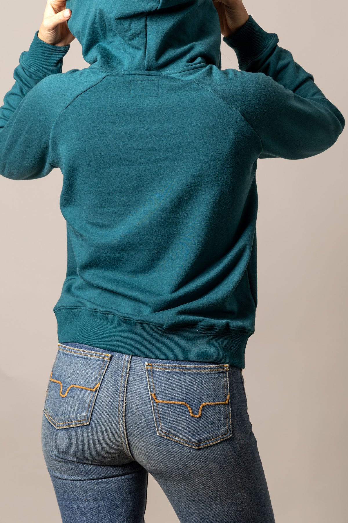 Kimes Ranch Kenzie Hoodie in Dark Teal, back view, with raglan sleeves and a back yoke
