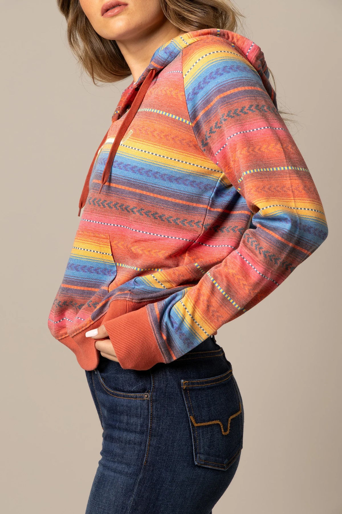 Kimes Ranch Kenzie Hoodie in Blue, side view, with a multi-color striped pattern and long sleeves