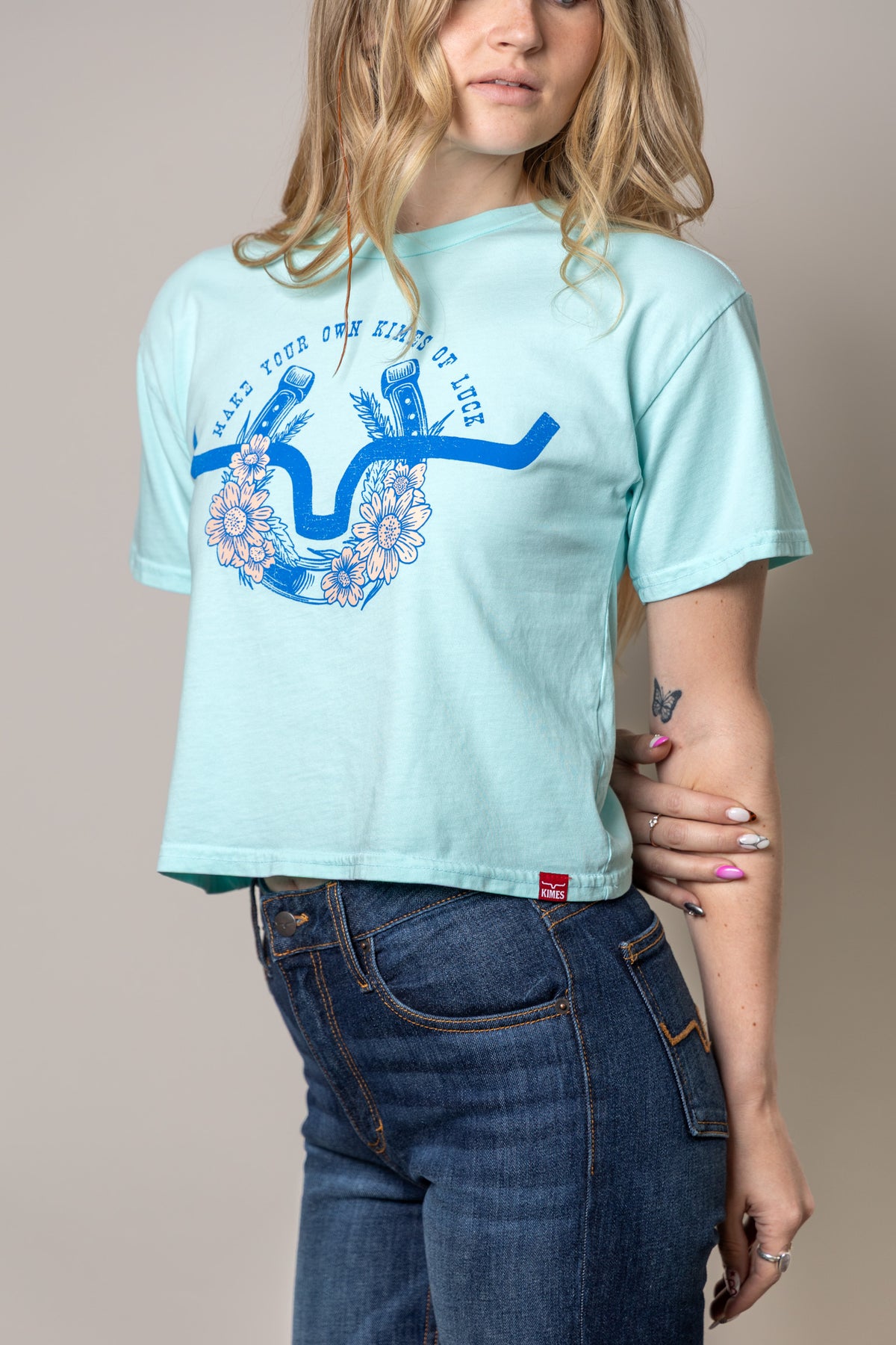Kimes Ranch Kimes Of Luck shirt in Mint with a blue horseshoe graphic with flowers and text MAKE YOUR OWN KIMES OF LUCK