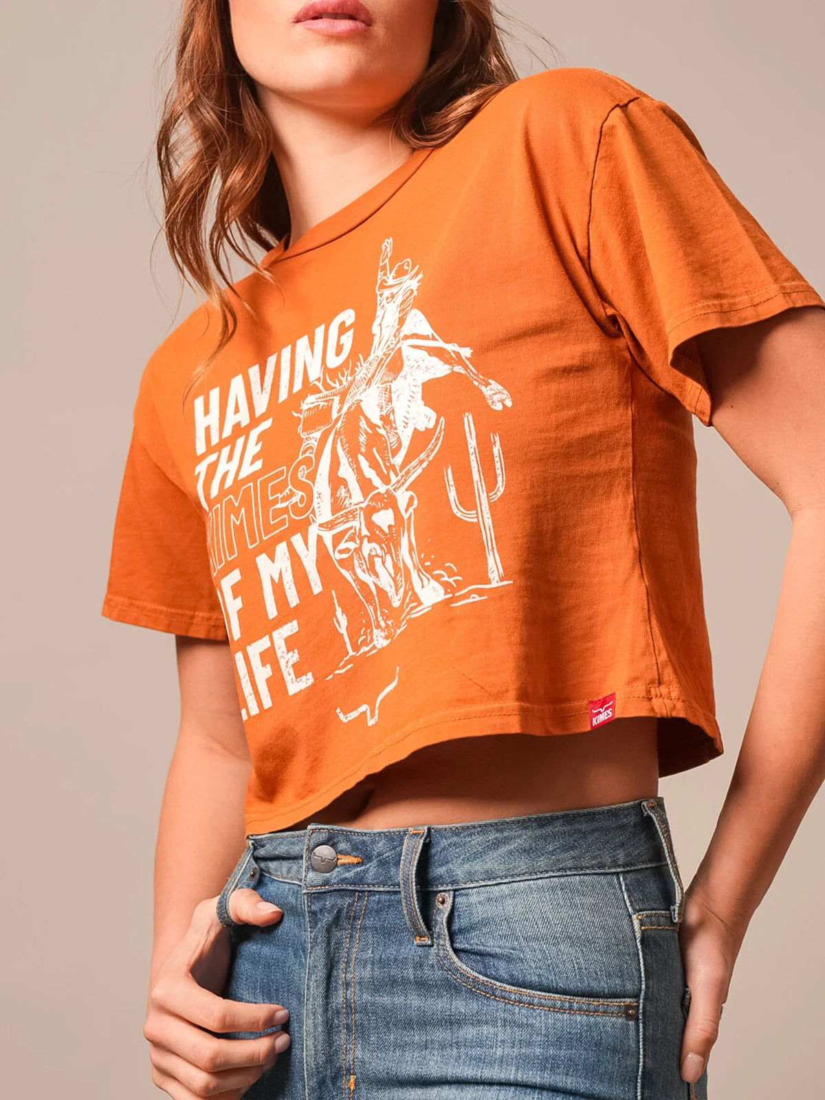 Kimes Ranch Kimes Of My Life short sleeve crop shirt in Rust with a white graphic of a cowboy riding a bull