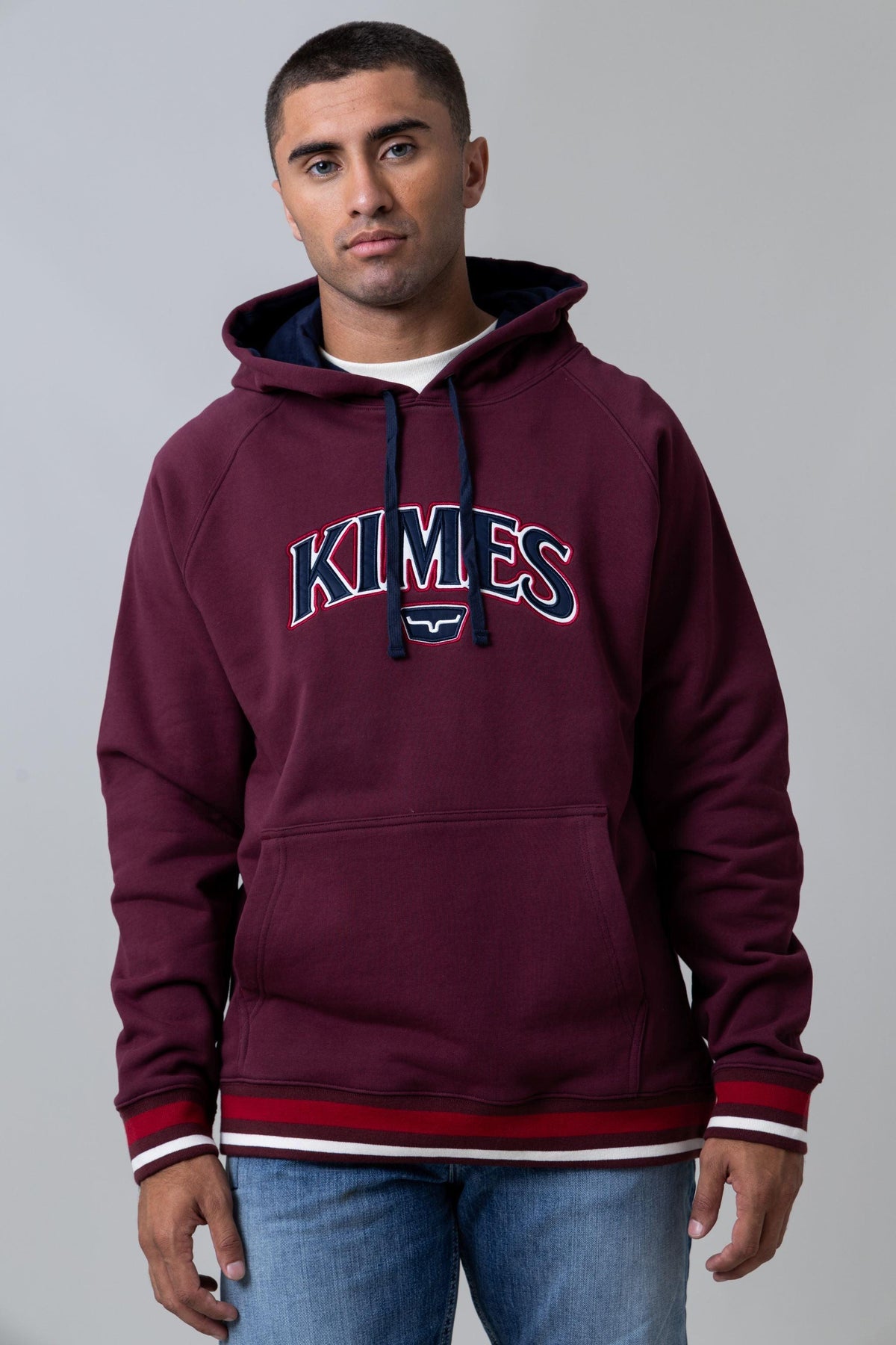 Kimes Ranch Kubo Hoodie in Burgundy with a front KIMES graphic and striped cuffs