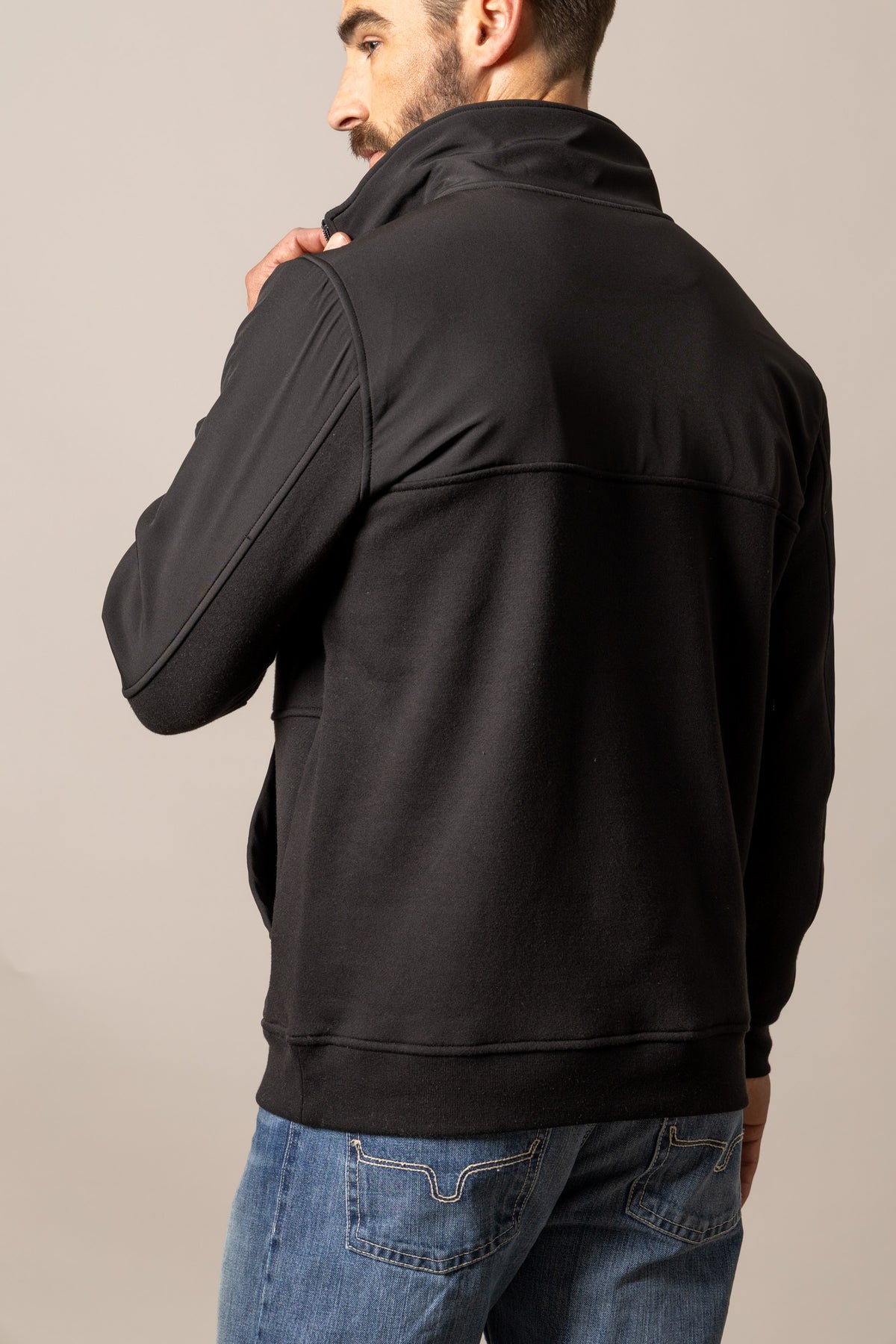 Kimes Ranch La Rue, side view, Black sweatshirt with a high collar and long sleeves