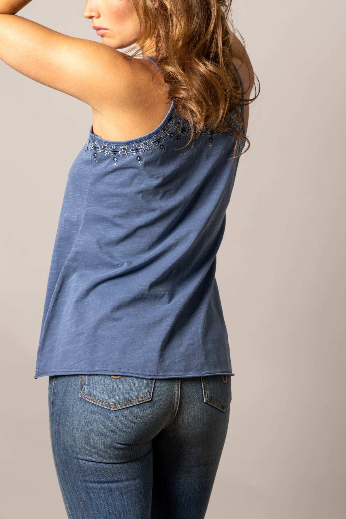 Kimes Ranch Lana top in Dark Blue, back view, with embroidered detail along the back neckline
