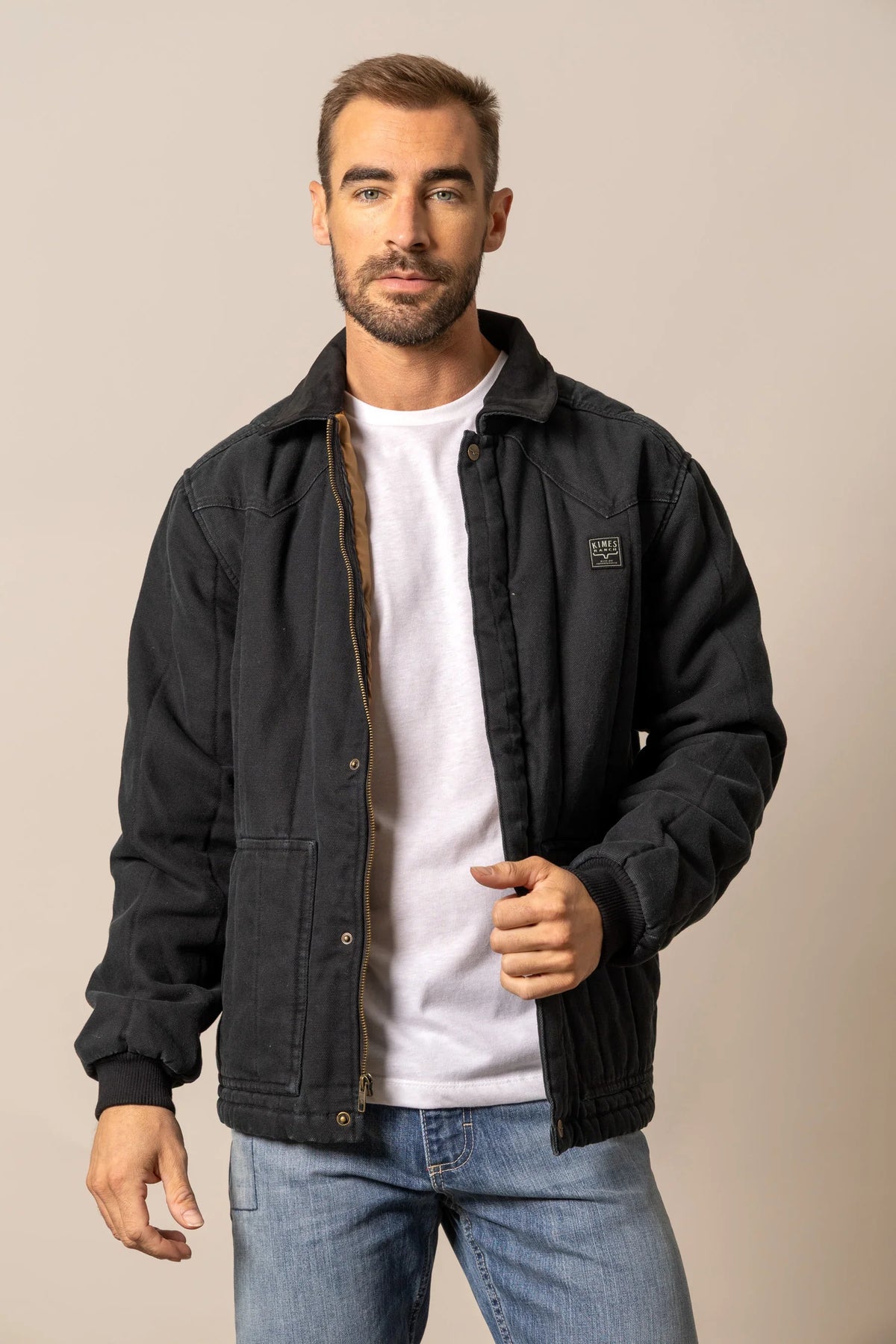 Kimes Ranch Lewiston Jacket in Black with a collar, front pockets, and the Kimes Ranch logo on the chest