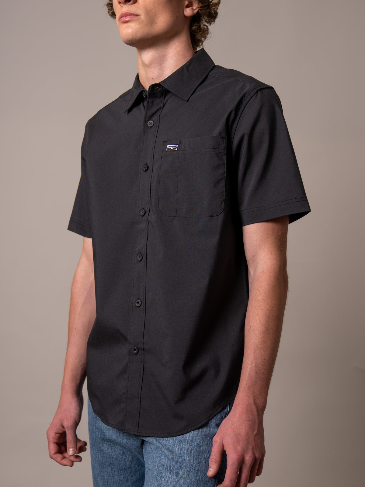 Kimes Ranch Linville Short Sleeve Dress Shirt in Black with a chest pocket and logo patch