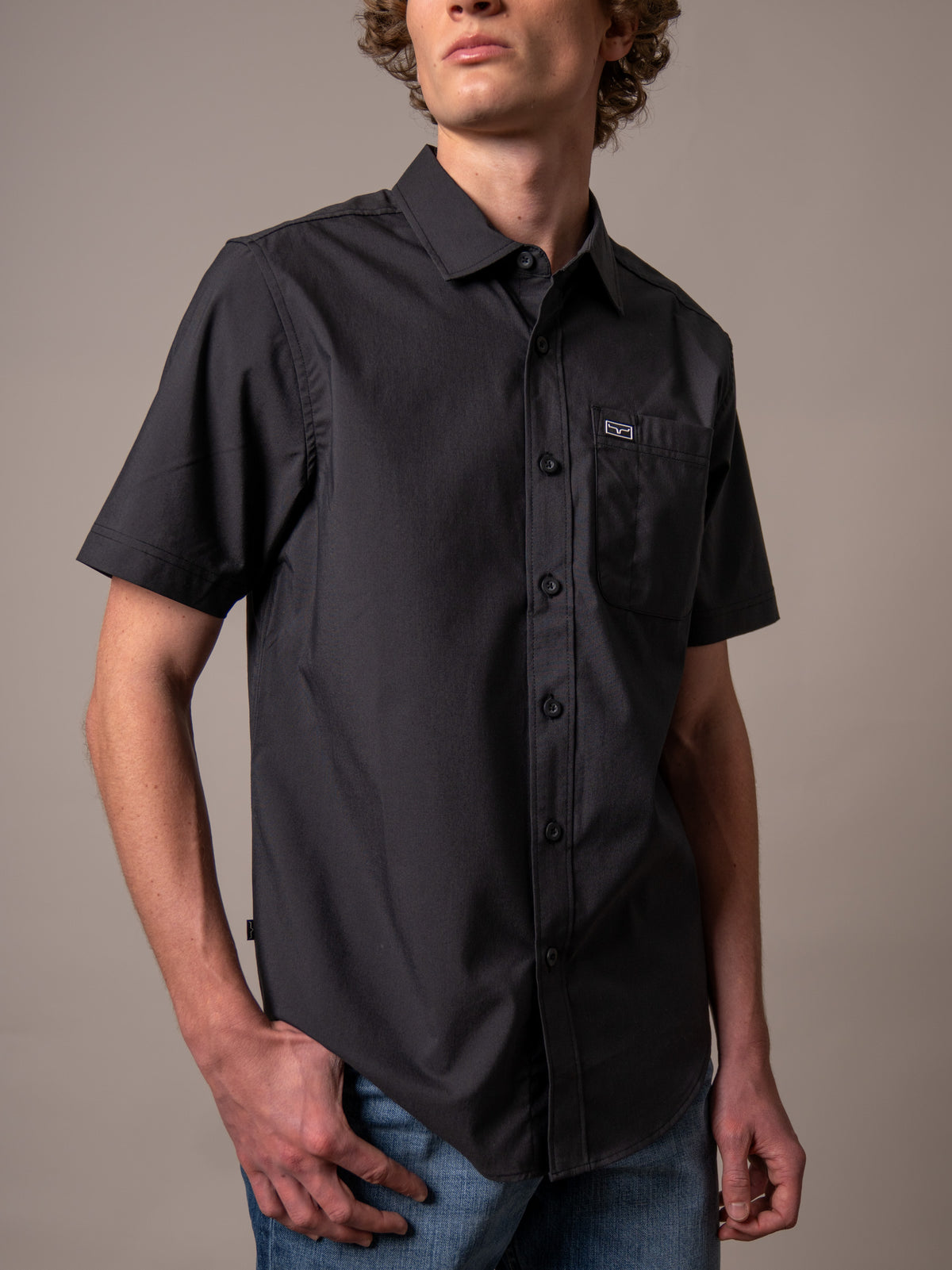 Kimes Ranch Linville Short Sleeve Dress Shirt in Black with a chest pocket and logo