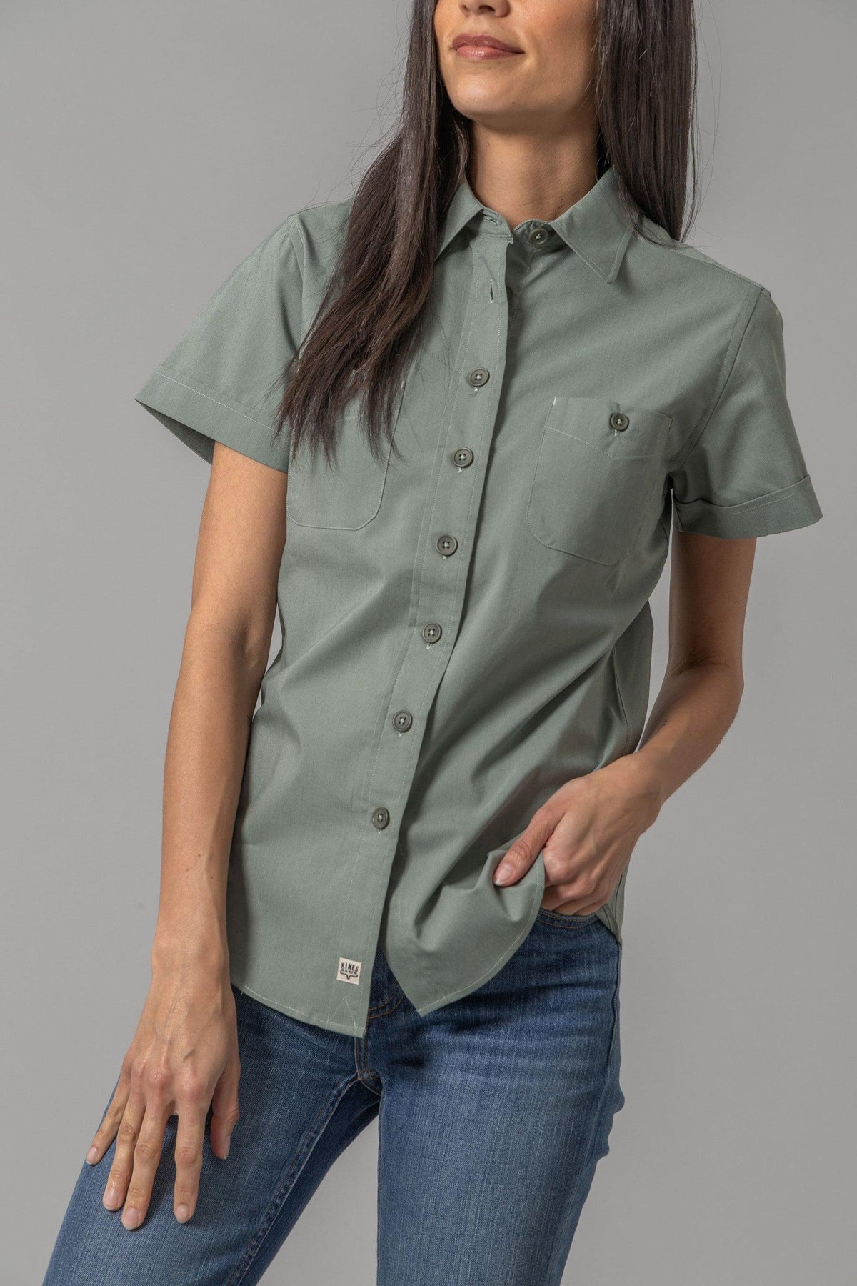 Kimes Ranch Ladies Linville Short Sleeve top in Pine with a button front and two chest pockets
