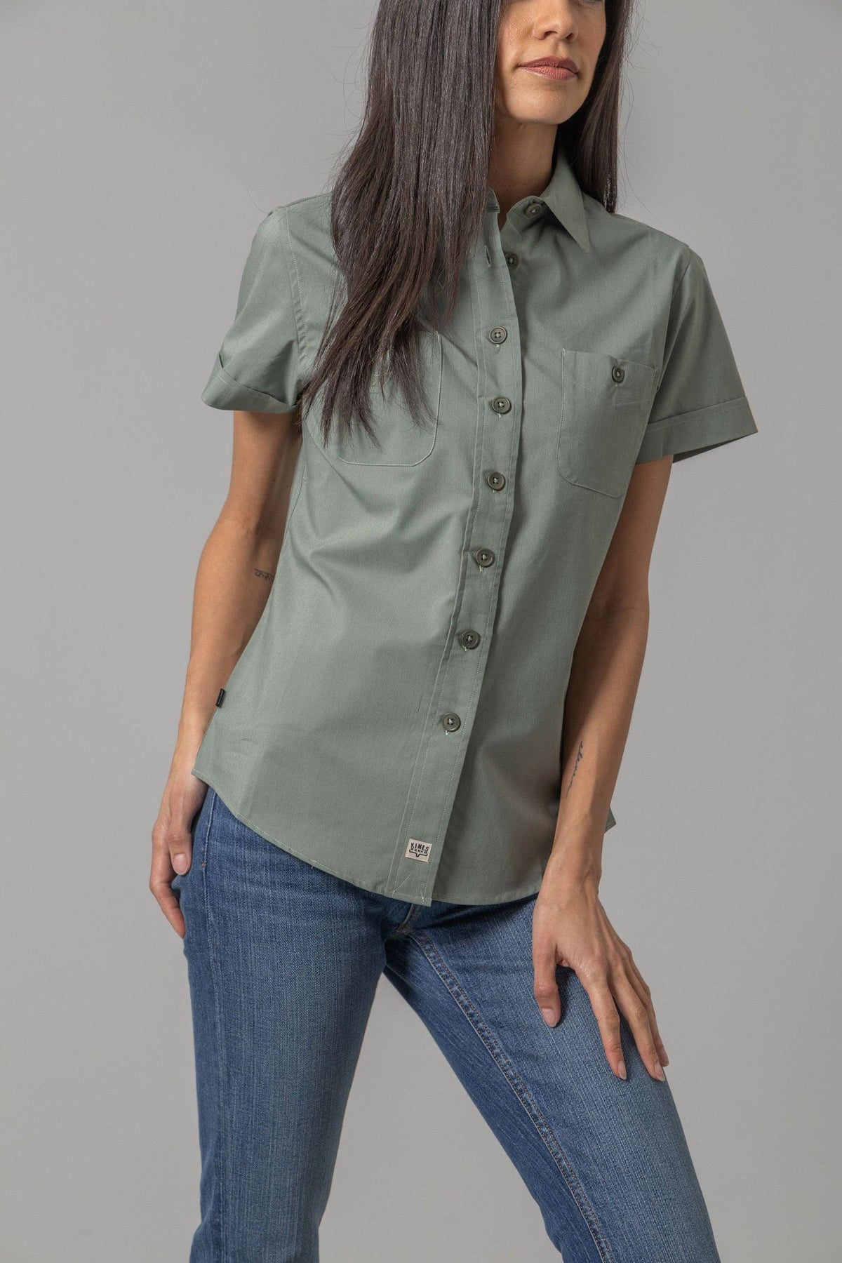 Kimes Ranch Ladies Linville Short Sleeve top in Pine with a button front and two chest pockets