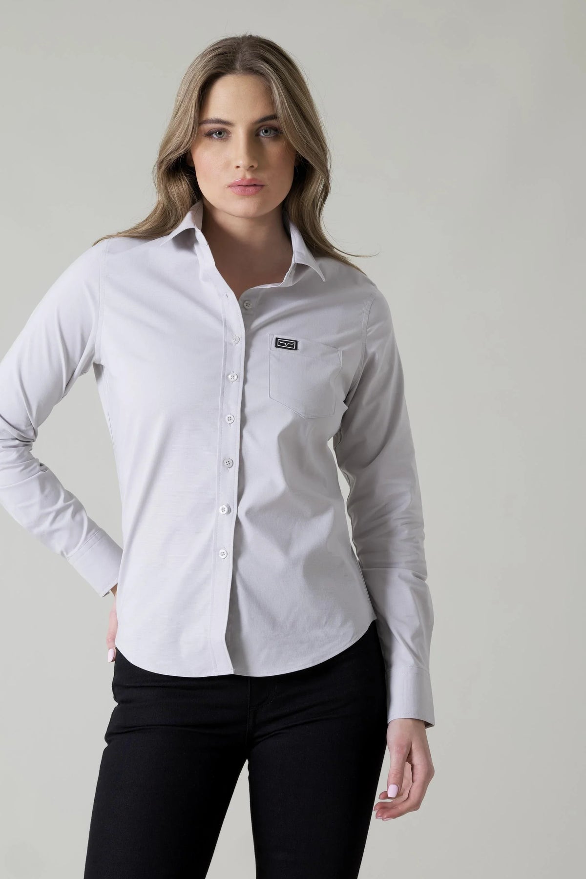 Kimes Ranch Ladies Linville top in Silver with a button front and a chest pocket with the Kimes Ranch logo