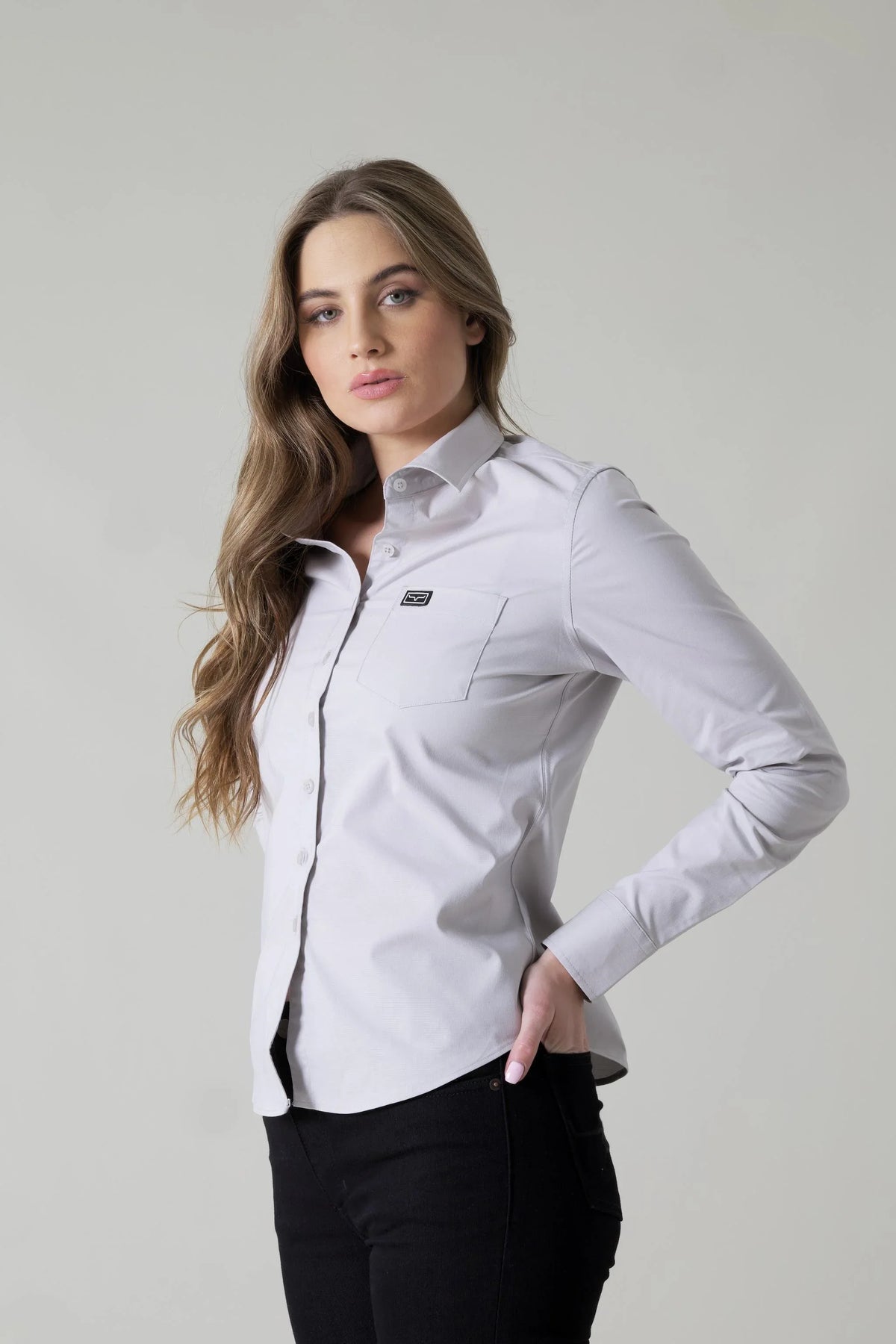 Kimes Ranch Ladies Linville long sleeve button-up top in Silver White with a chest pocket and logo